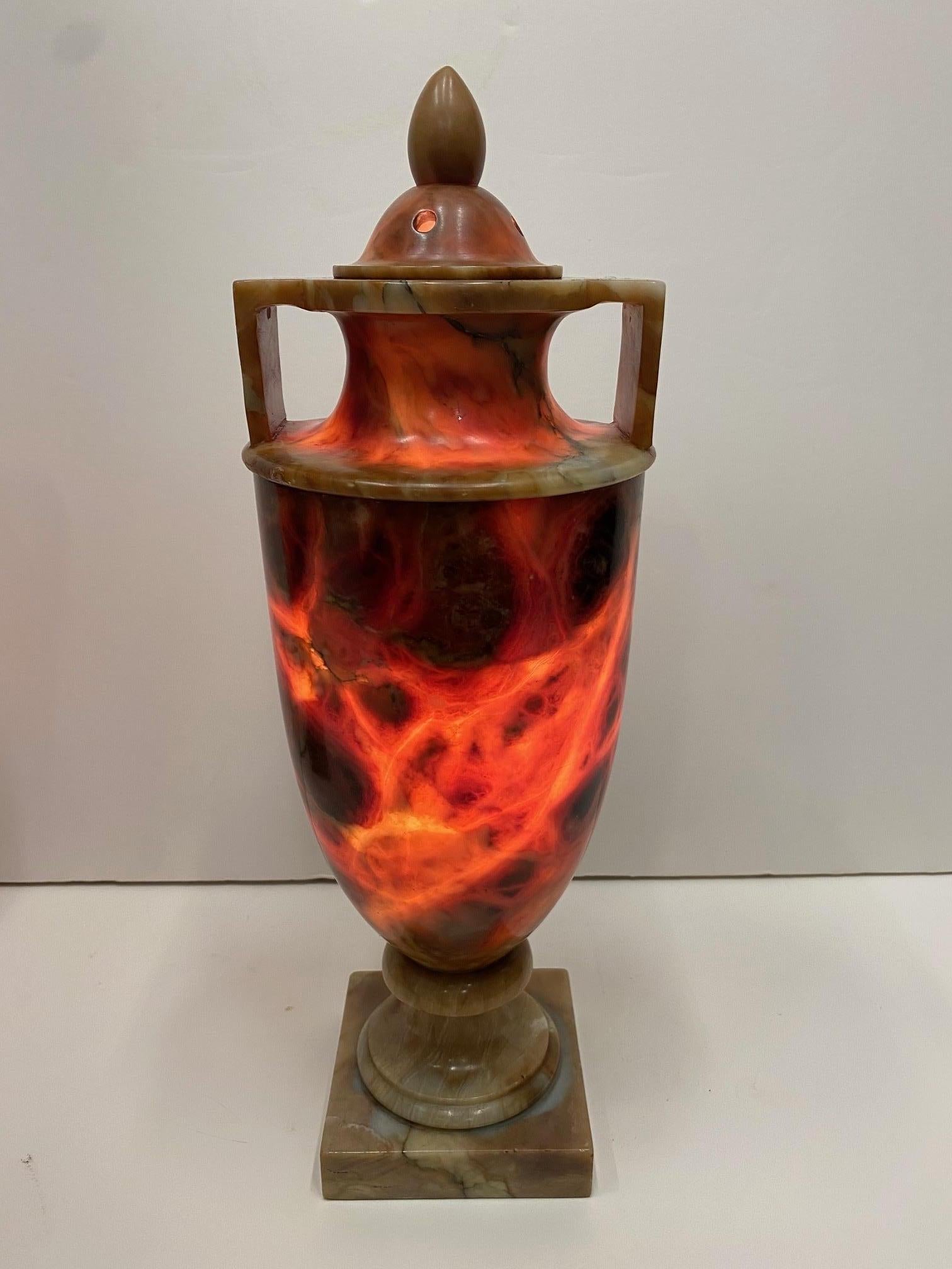 A pair of incredible urn lamps that are beautiful as sculptural accessories whether unlit or illuminated, but when lit they become glowing embers with startlingly lovely colors.
Newly rewired.