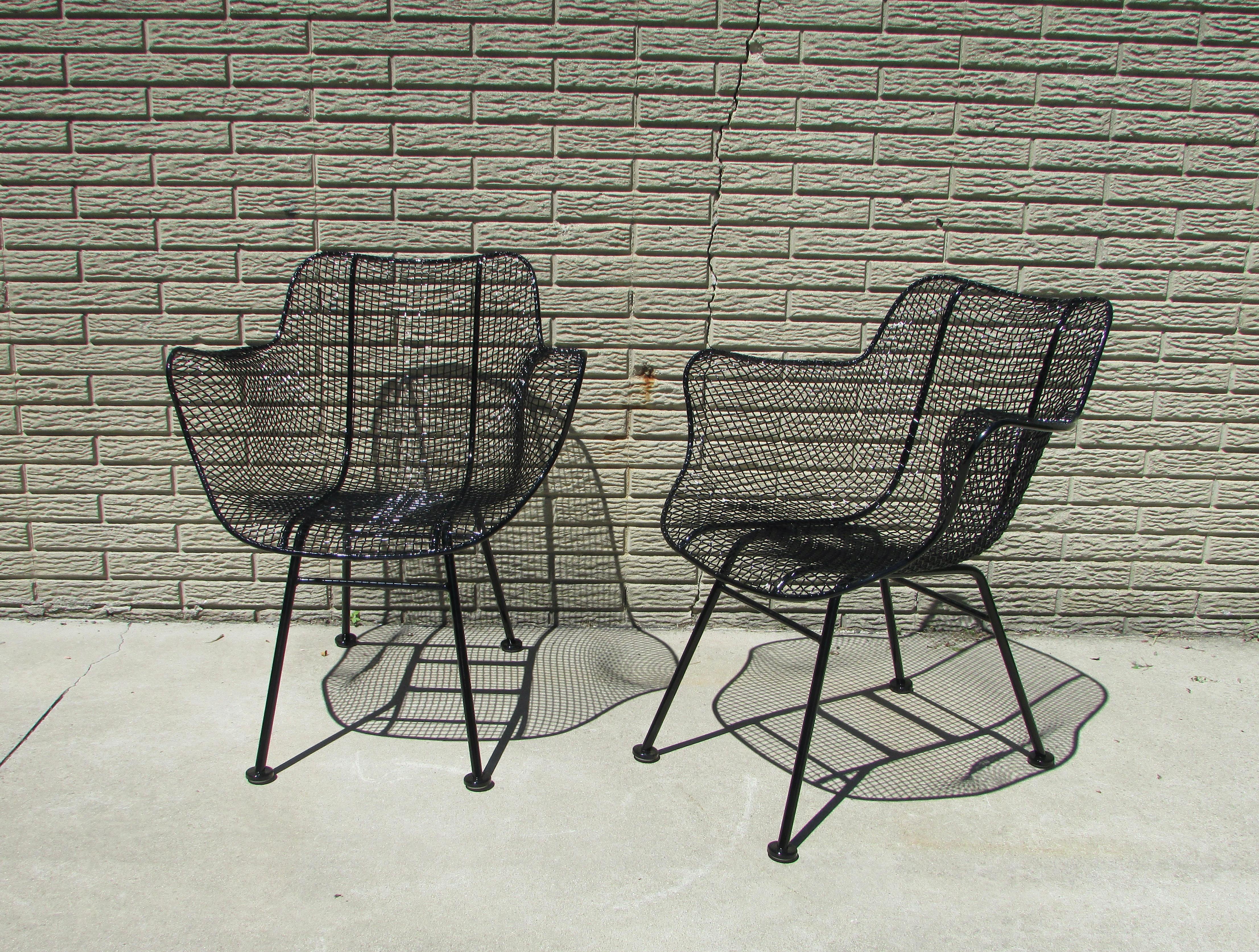 Mid-Century Modern Pair of Gloss Black Woodard Wrought Iron Frame with Steel Mesh Armchairs For Sale