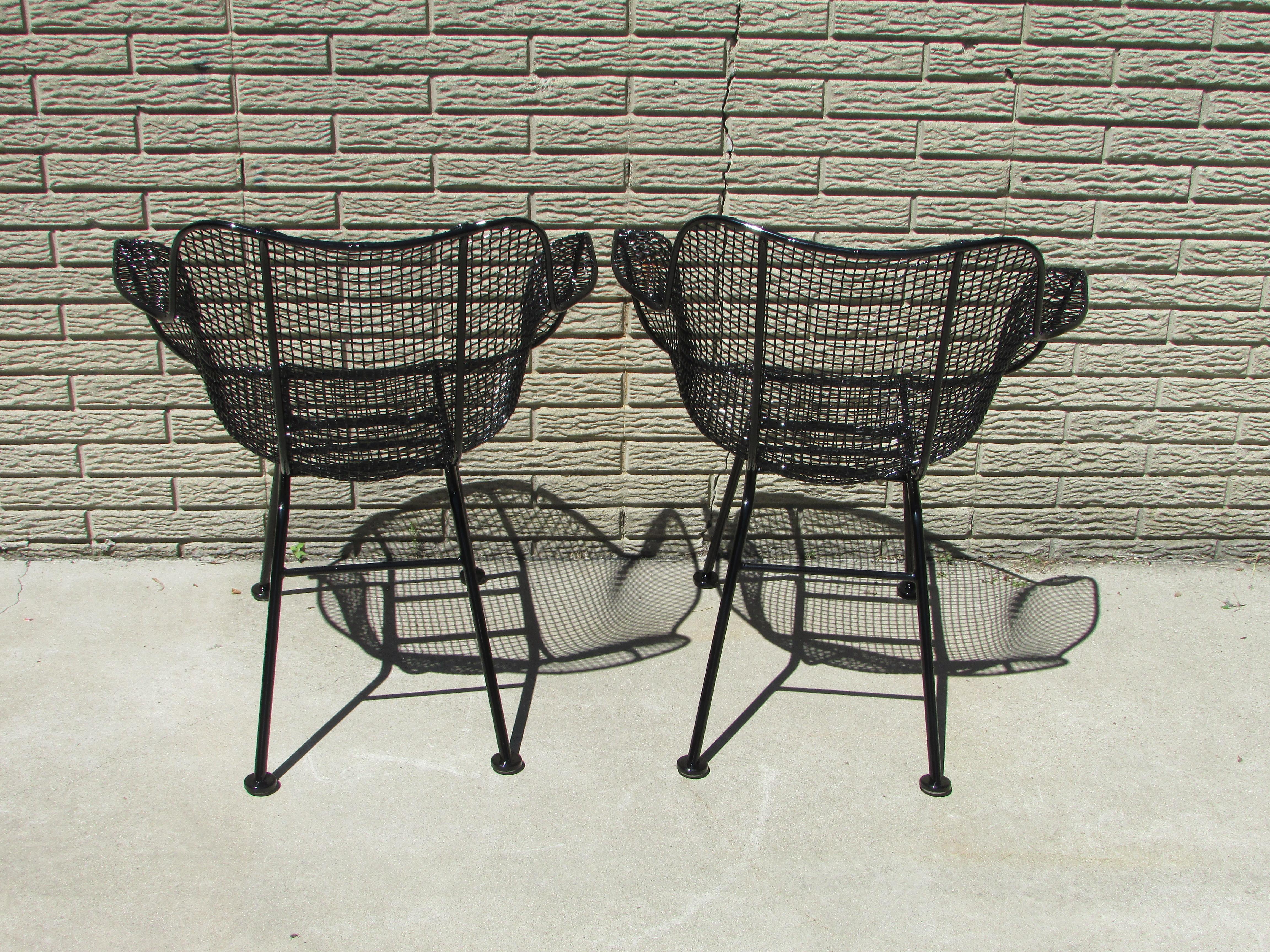 20th Century Pair of Gloss Black Woodard Wrought Iron Frame with Steel Mesh Armchairs For Sale