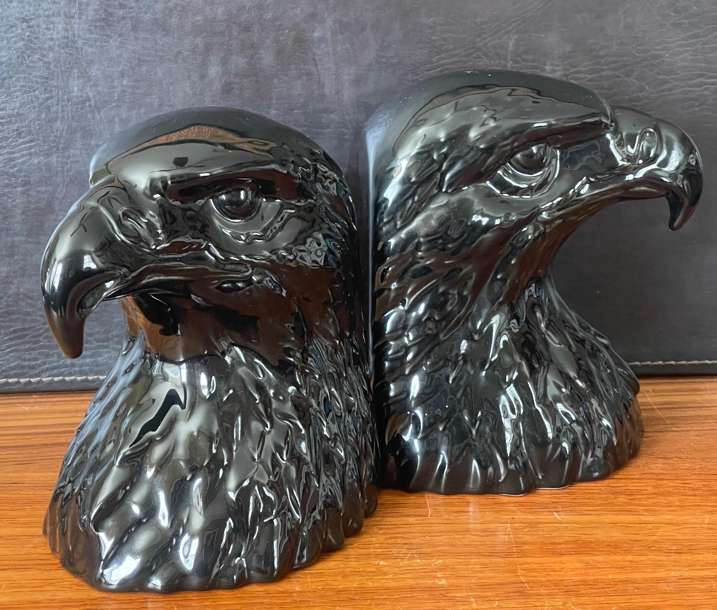 A very cool pair of glossy black porcelain bald eagle head bookends by Hispania Dasio / Lladro of Spain, circa 1985. The set is quite striking and in very good vintage condition with no chips or cracks; the pair measure 13.5