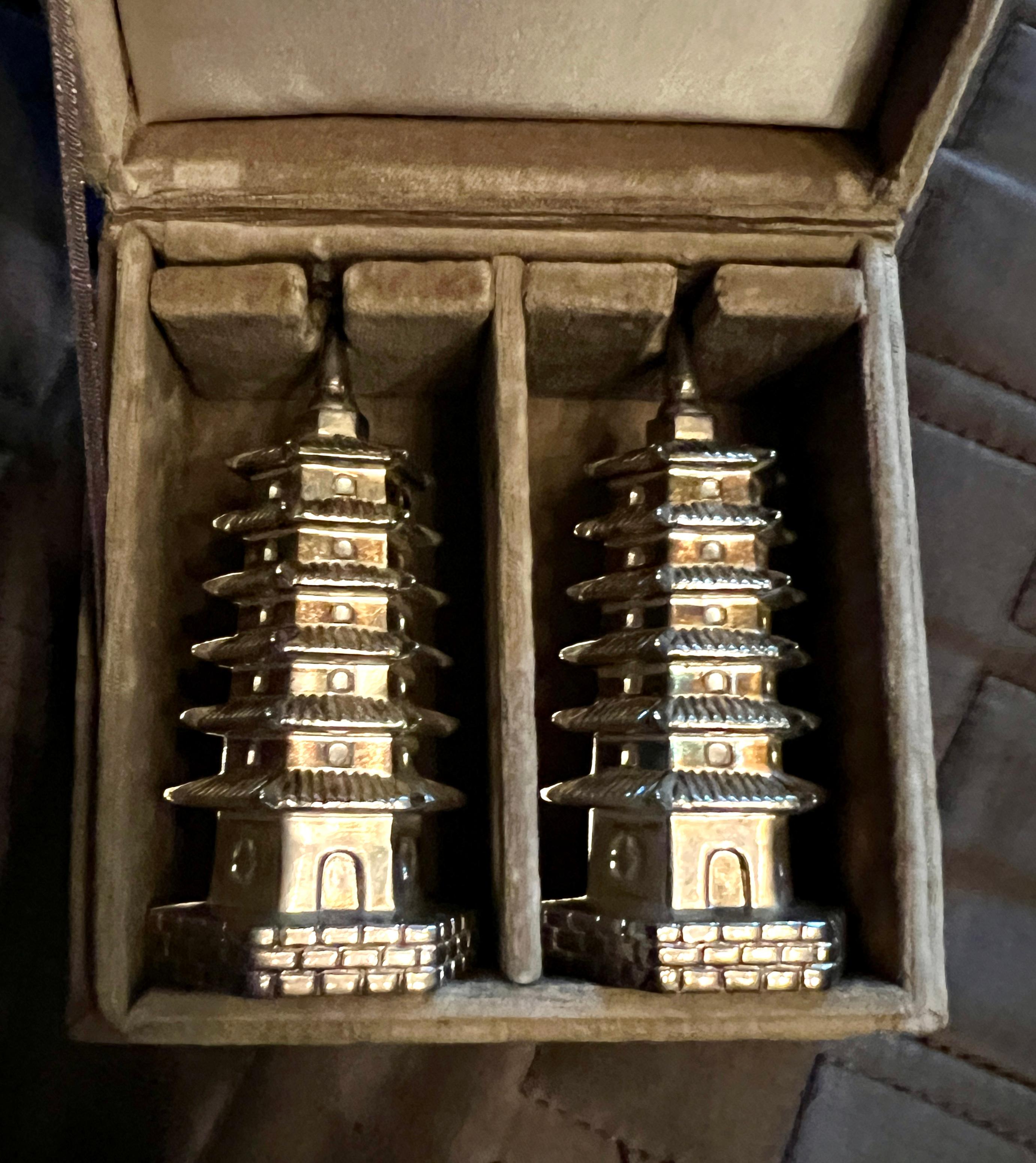 A fantastic pair of Chinoiserie Pagoda Style Salt and Pepper Shakers in the 
original Nieman Marcus Box.

The pair are a compliment to any table and especially on those asian dinner nights - The pair come in a box for easy storage.

We have found