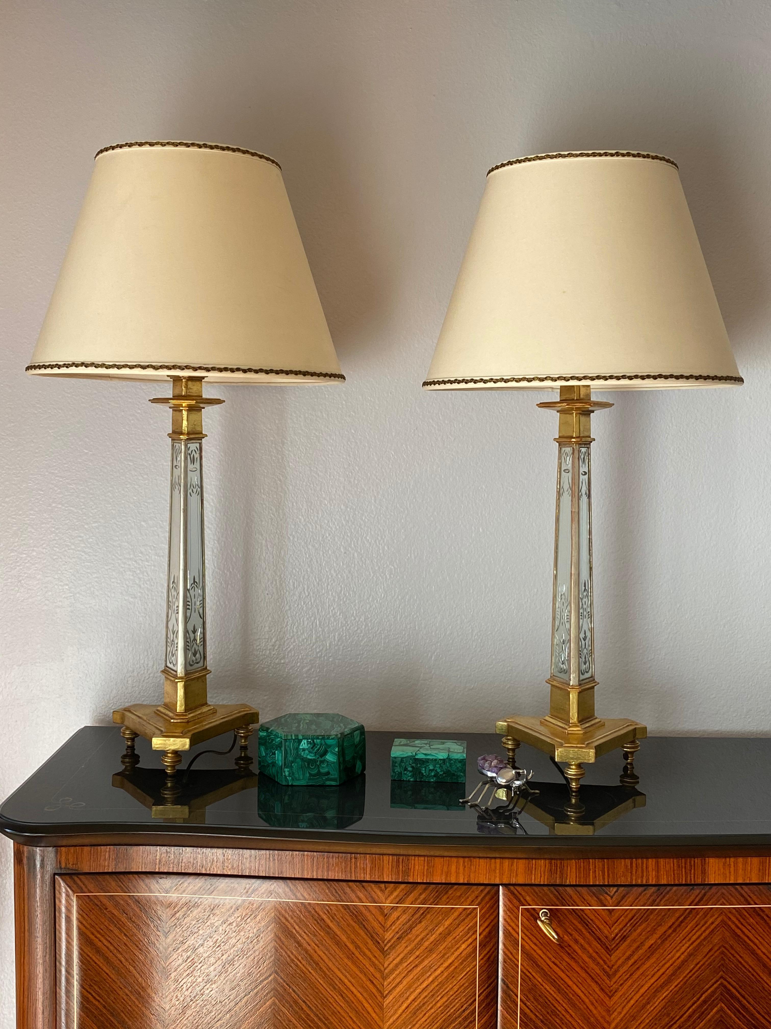 Pair of 22-karat gold leaf and etched mirror lamps with original shades. Shade is 16