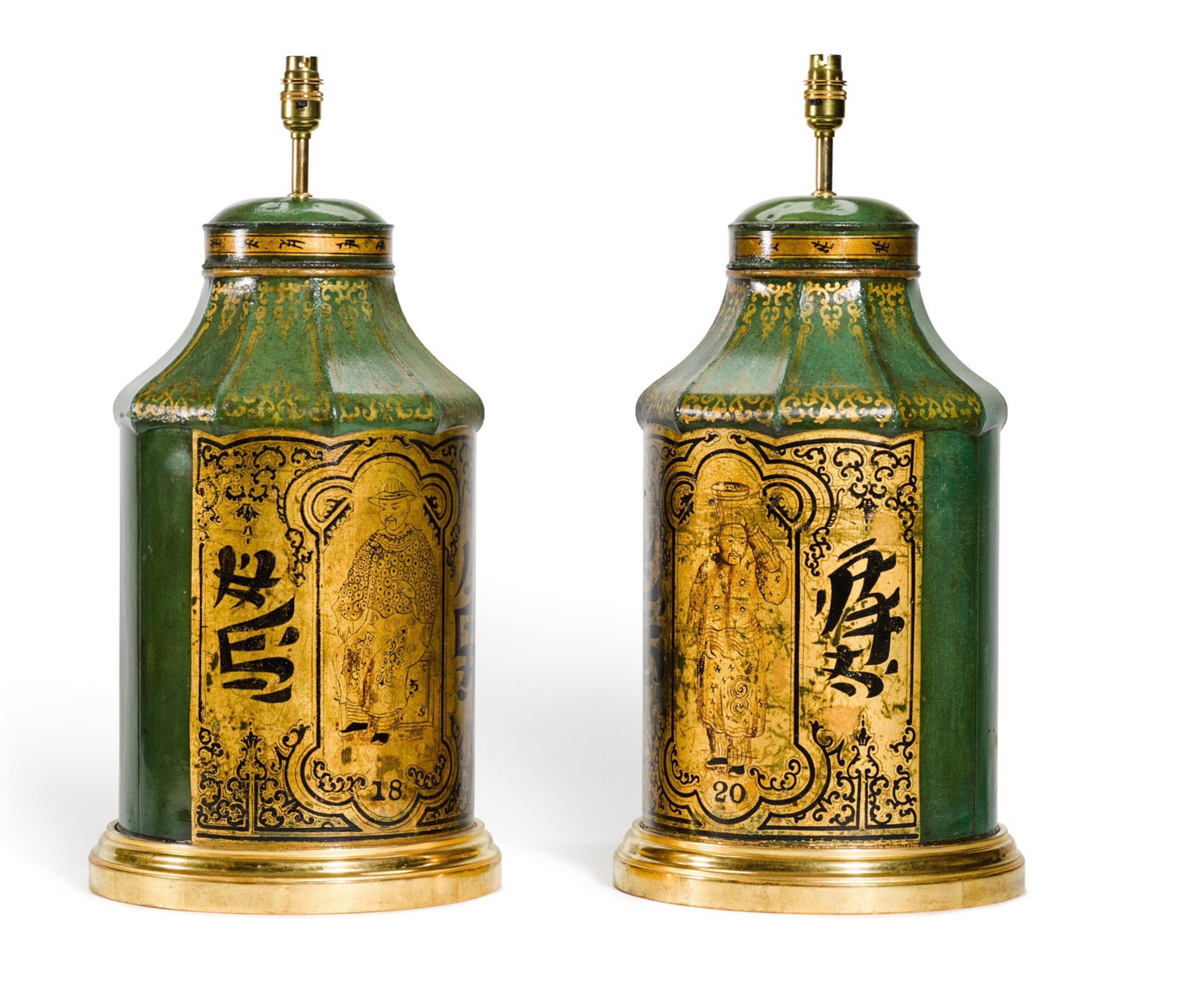 A magnificent pair of late 19th century green and gilt chinoiserie decorated tea canisters of rounded form with pagoda shaped tops, now mounted as lamps with hand gilded turned bases.

Height of vases: 19 ³/4 in (50cm) including giltwood base,