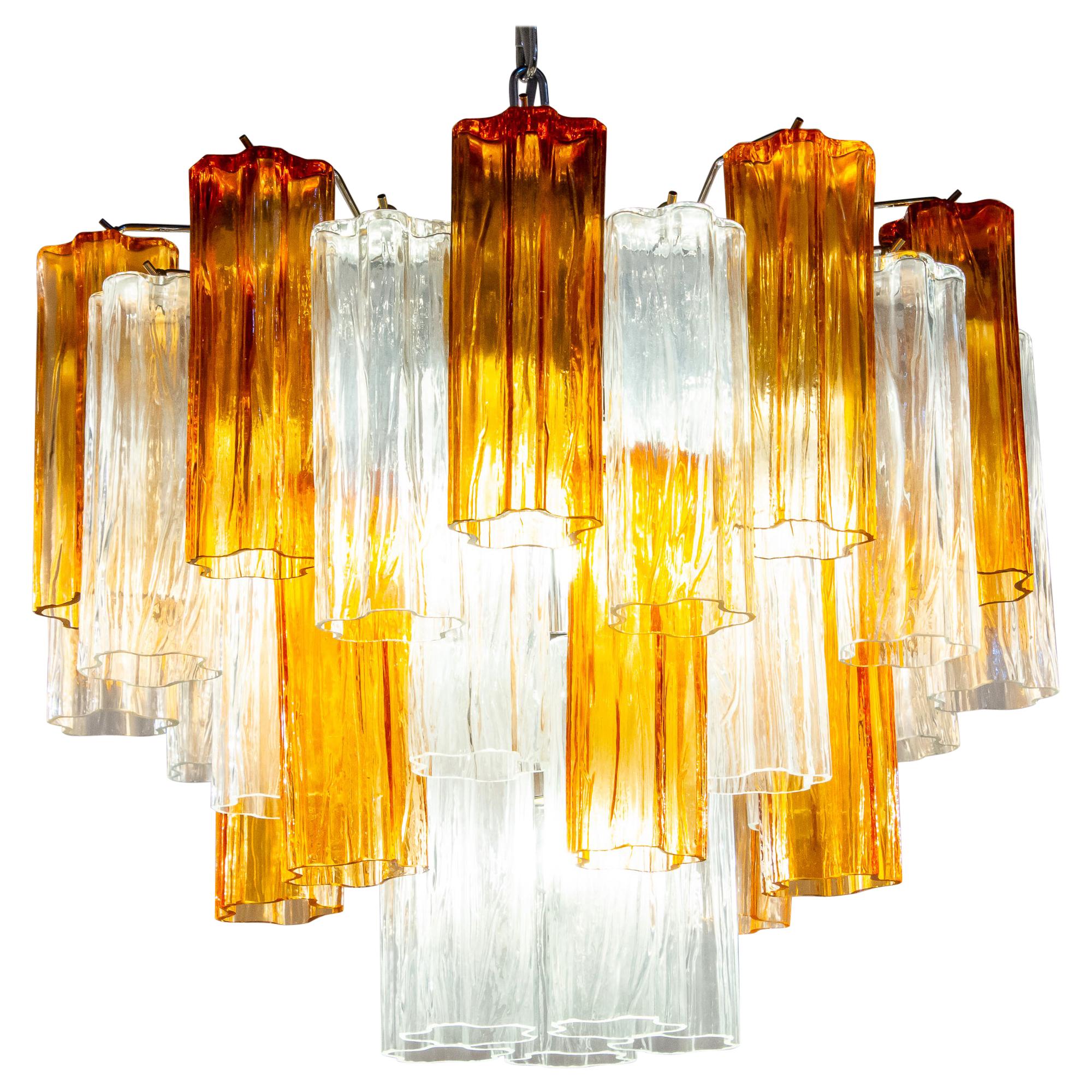 Amazing pair chandelier includes precious gold amber color and clear tronchi Murano glasses 20 cm long.
Nickel-plated metal structure on three levels,
Perfect vintage condition.
Available 8 chandeliers and 4 pairs of sconces.



   