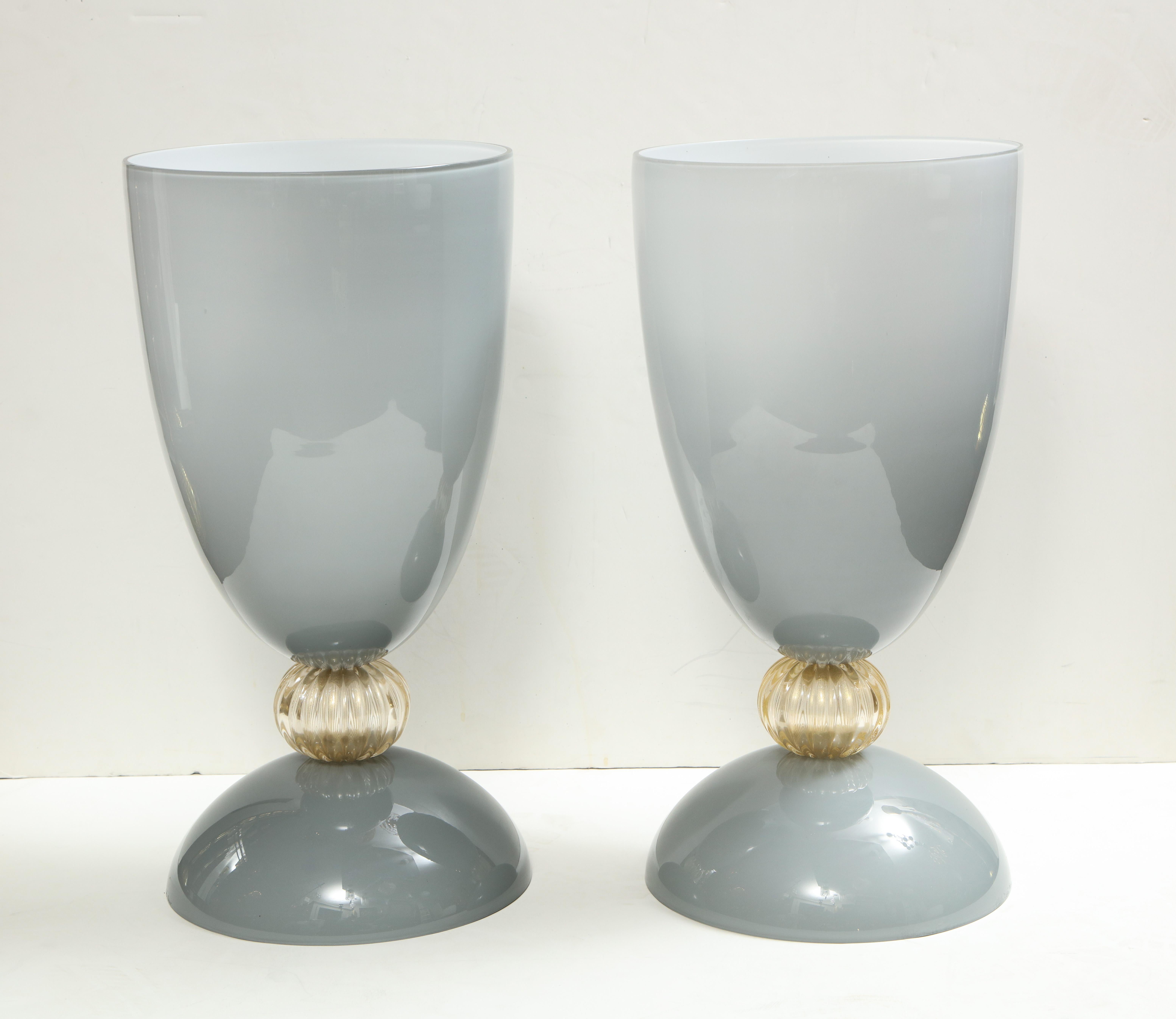 Beautiful pair of over-sized gray incamiciato Murano glass vases accented with gold aventurina glass ball.