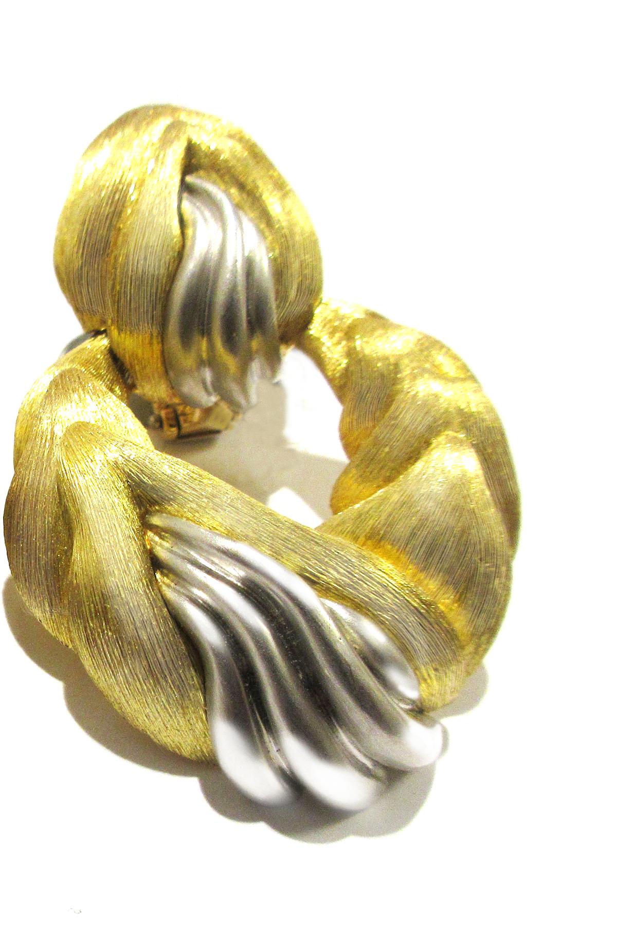 18kt., composed of brushed gold bombé wavy chevrons, with inserts of tapered platinum ribs, signed 'Dunay, no. B1615' with maker's mark, approximately dwts.