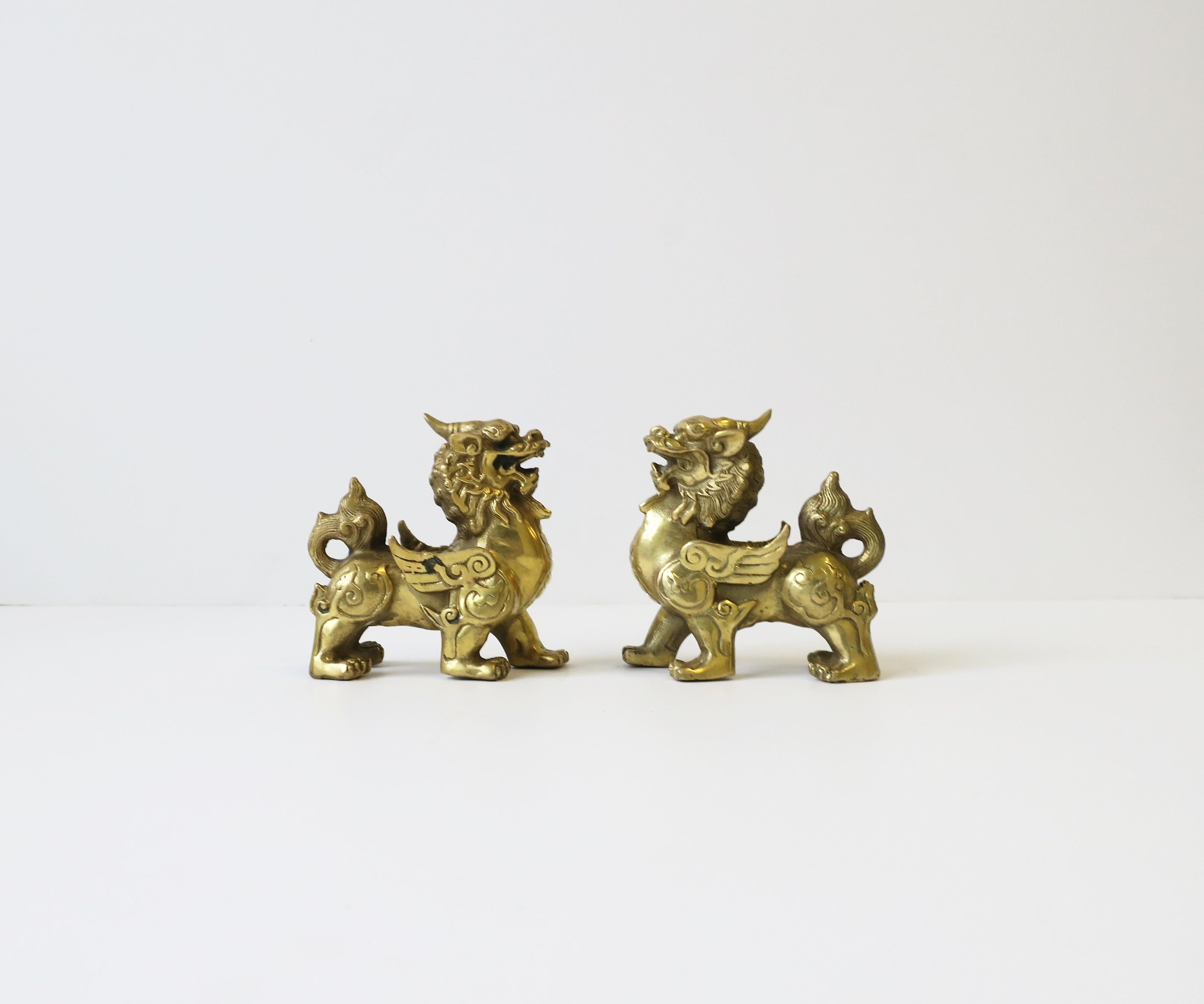 A great pair of gold brass Lion Foo dog sculptures/decorative objects, circa 20th century. Beautiful detail all around as shown in images. Dimensions: 2