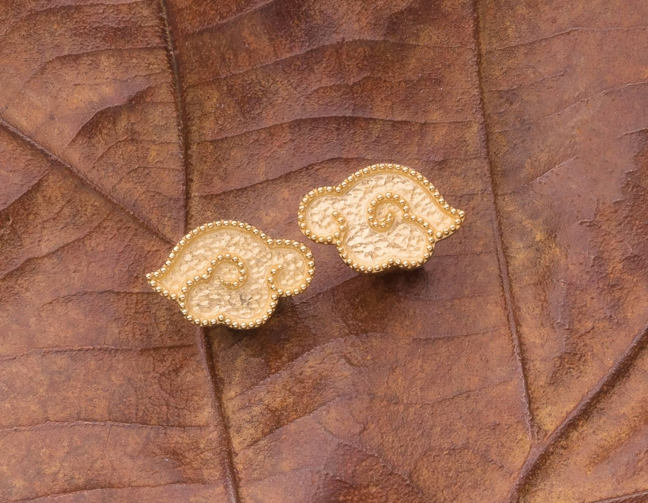 the pair of charming handcrafted solid 18 karat gold earrings, from our Heritage Collection of Chinoiserie designs, in the form of hand-hammered clouds with delicate beaded edges, clip and post 
Total weight 7.68gm
Size ¾ in W x ½ in H (2cmW x