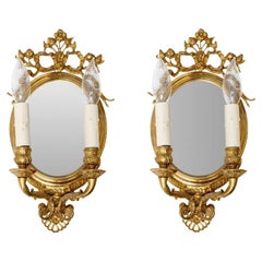 Pair Of Gold Finished Mirror Back Double Arm Wall Sconces