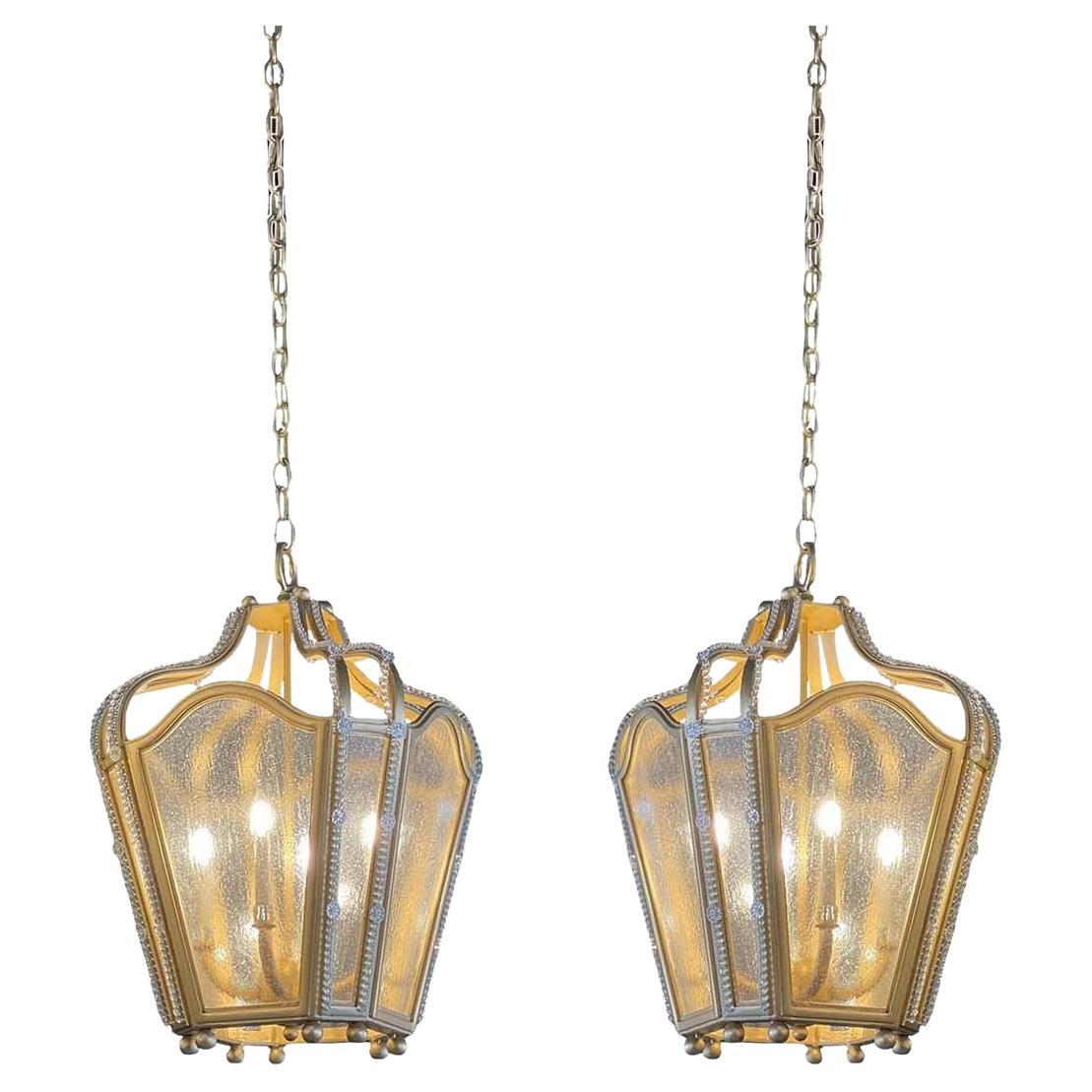 Pair of Gold Finished Wrought Iron Lanterns with Textured Glass and Glass Beads For Sale