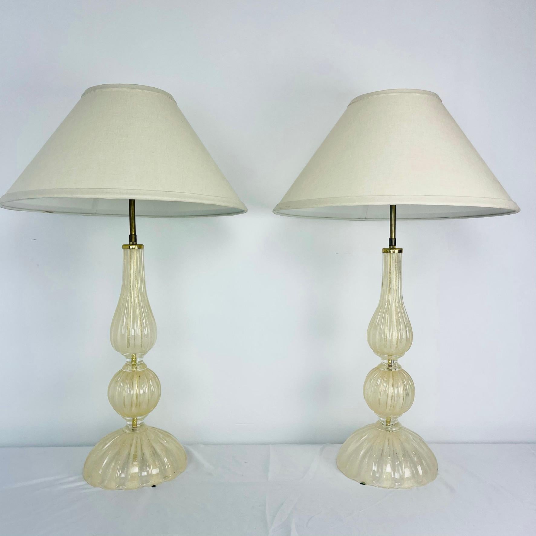 Gorgeous pair of gold fleck Murano glass table lamps by Seguso Vetri d'Arte. Shades not included.