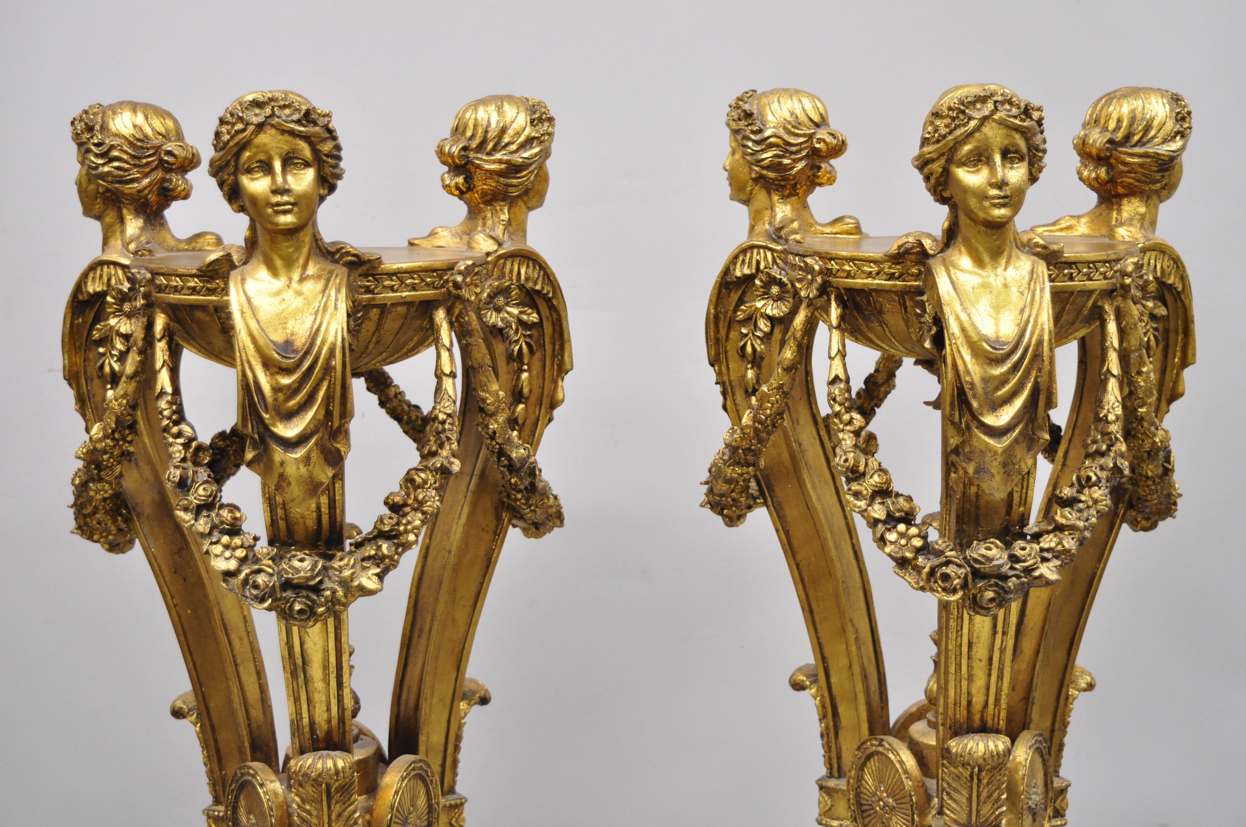 Pair of gold French neoclassical style figural maiden bust hoof foot pedestals. Item features 3 maiden busts, hoof feet, urn form finials, gold leaf finish, cast resin forms, nicely carved details, great style and form, circa mid-20th century.