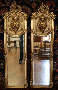 Pair of Gold French Rococo Louis XVI Style Figural Tall Narrow Beveled Mirrors