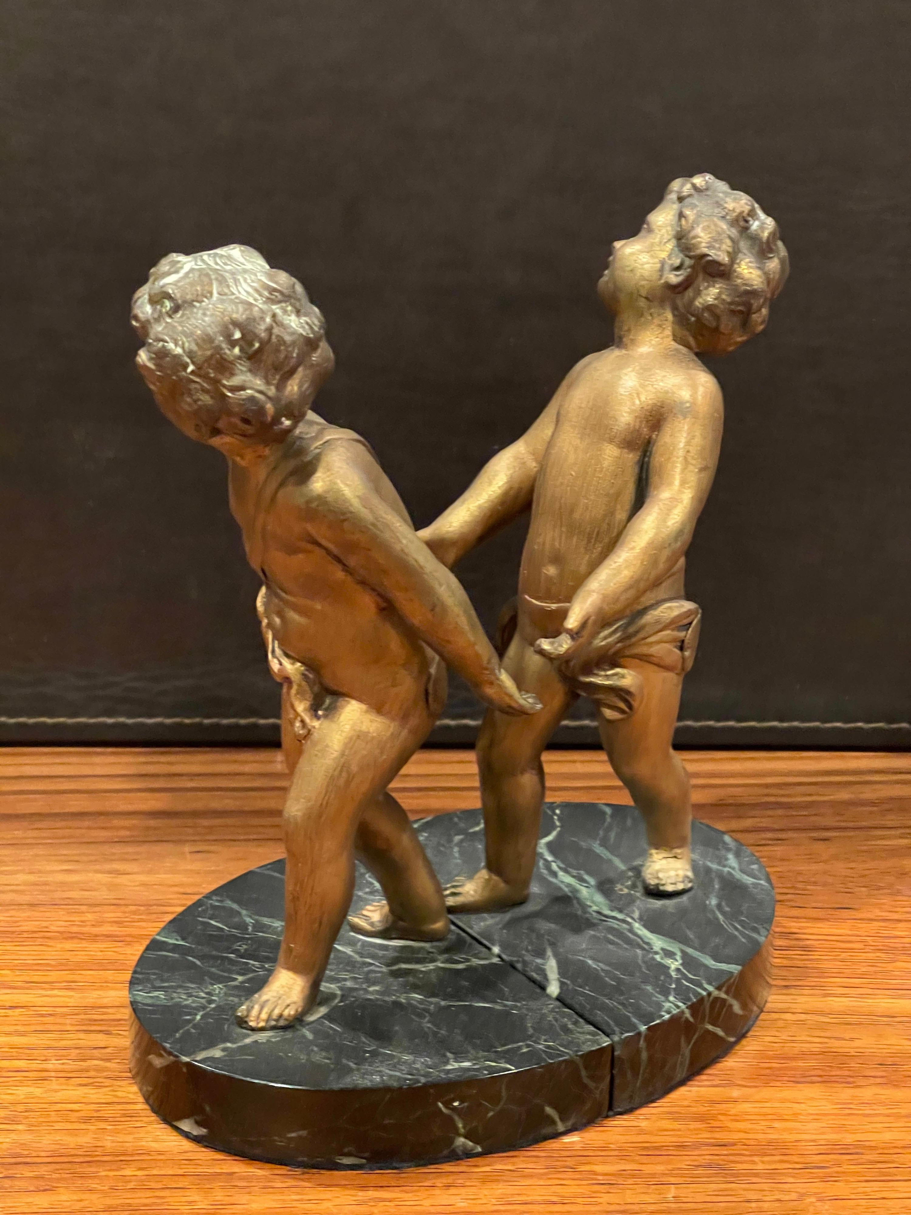 Pair of Gold Gilt Cherubs on Marble French Art Deco Bookends In Good Condition For Sale In San Diego, CA