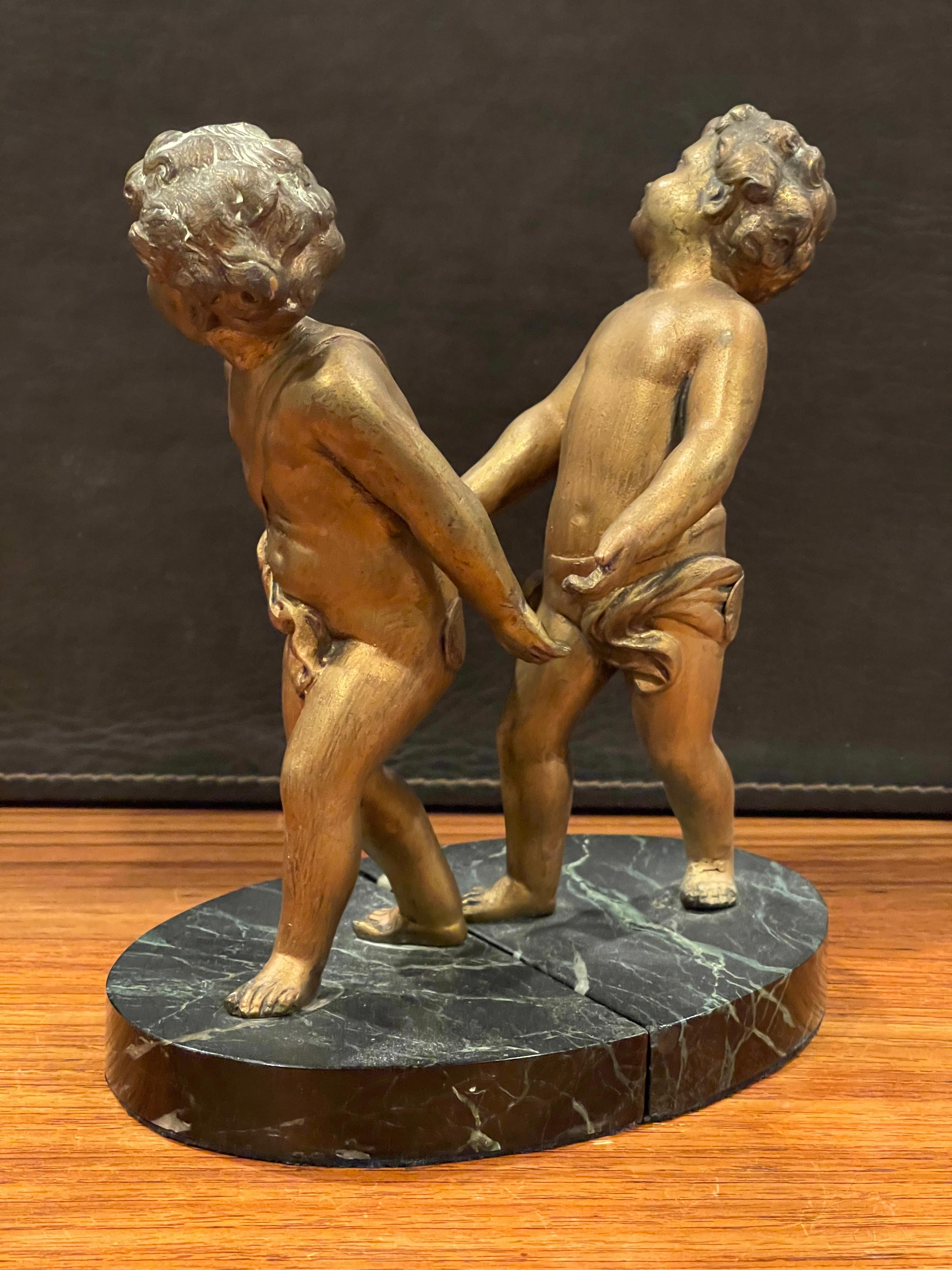 20th Century Pair of Gold Gilt Cherubs on Marble French Art Deco Bookends For Sale