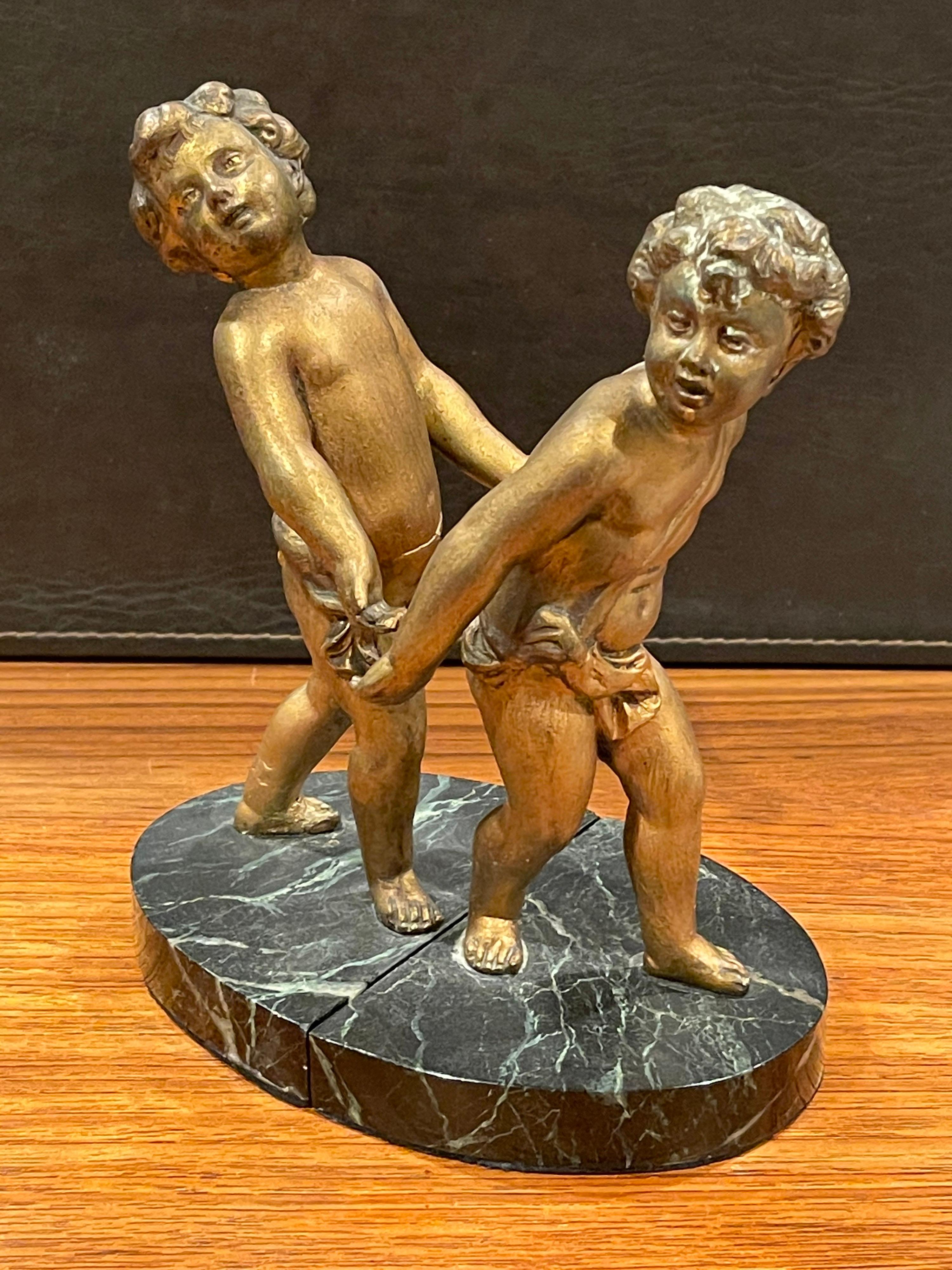 Pair of Gold Gilt Cherubs on Marble French Art Deco Bookends For Sale 2