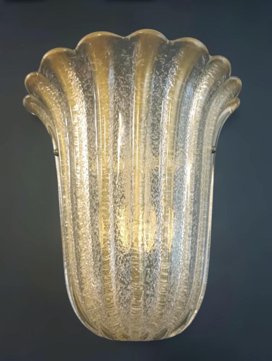 Italian wall light with a Murano glass shield infused with gold, hand blown in Graniglia technique to produce granular textured effect / Made in Italy by Barovier e Toso, 1960s
Original label on glass and frame
Measures: Height 12 inches, width 12