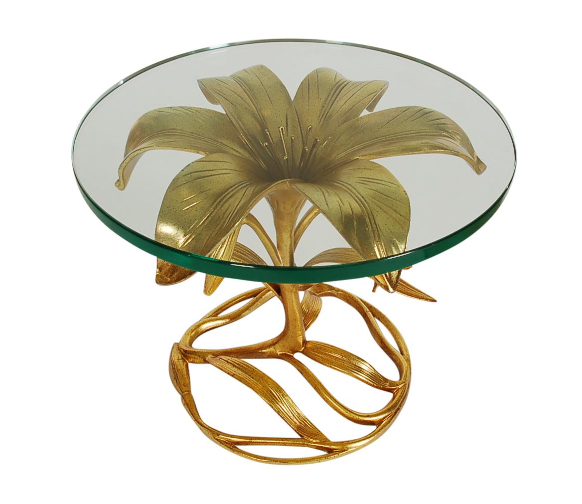 A lovely matching pair of lily form tables designed by Arthur Court in the 1960s. These feature cast aluminum bases, gold lacquer finish, and extra thick glass tops. Beautiful original condition and ready for use.