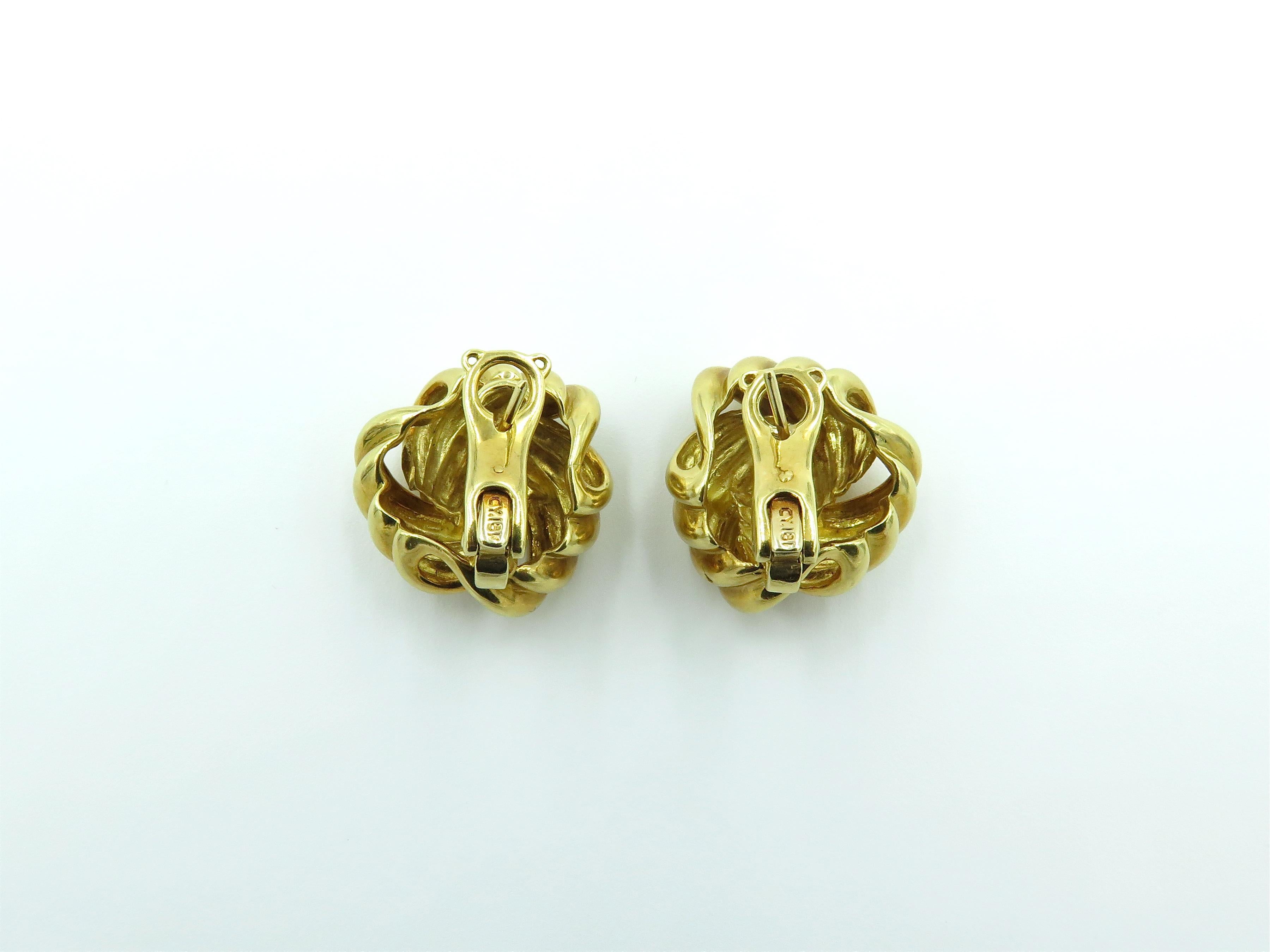 A pair of 18K yellow gold knot earrings. Stamped CY 18K. Gross weight approximately 23.3 grams.