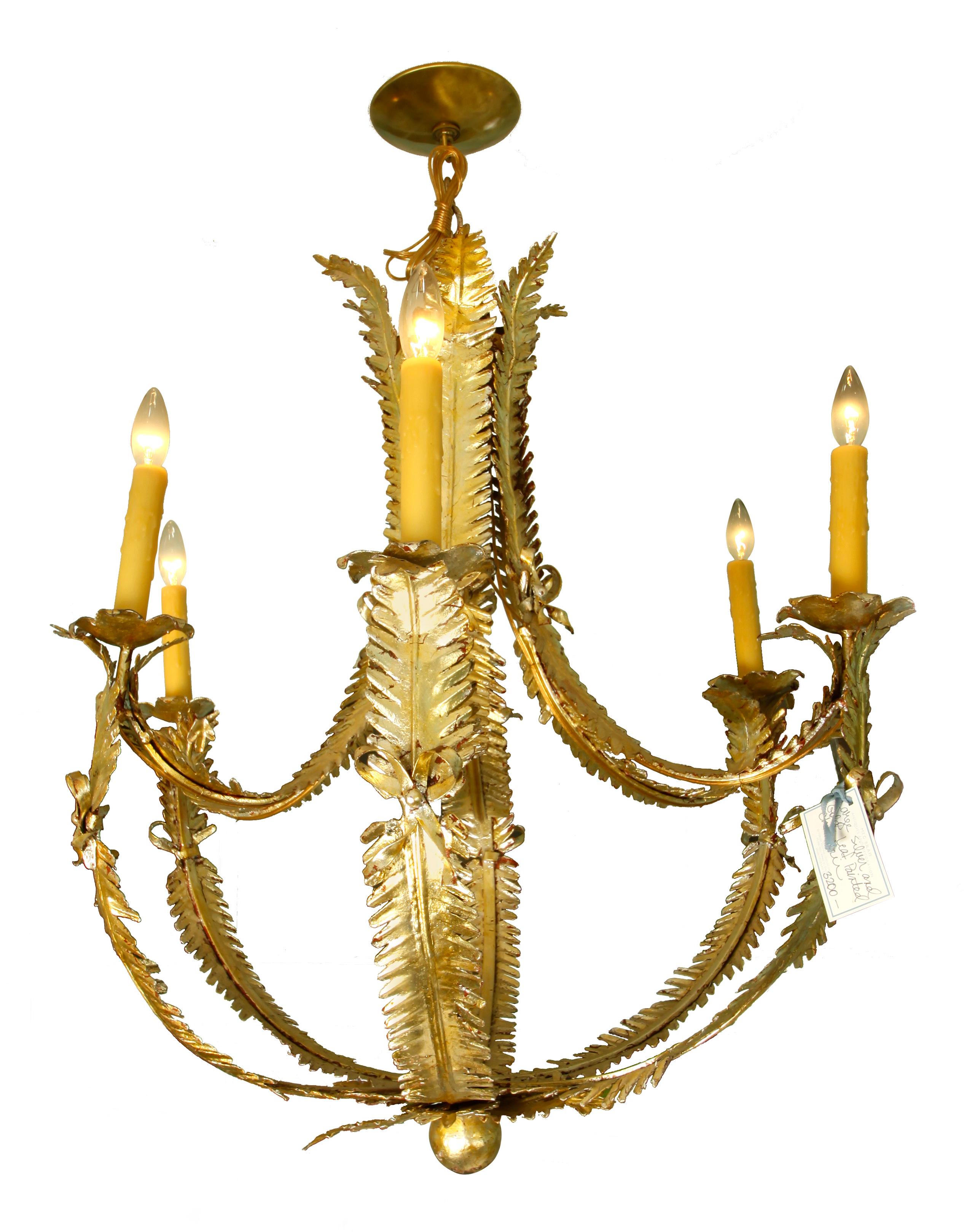 A pair of gold leaf foliate 6-light metal chandeliers. Delicate fern frond shapes with bows at joints.