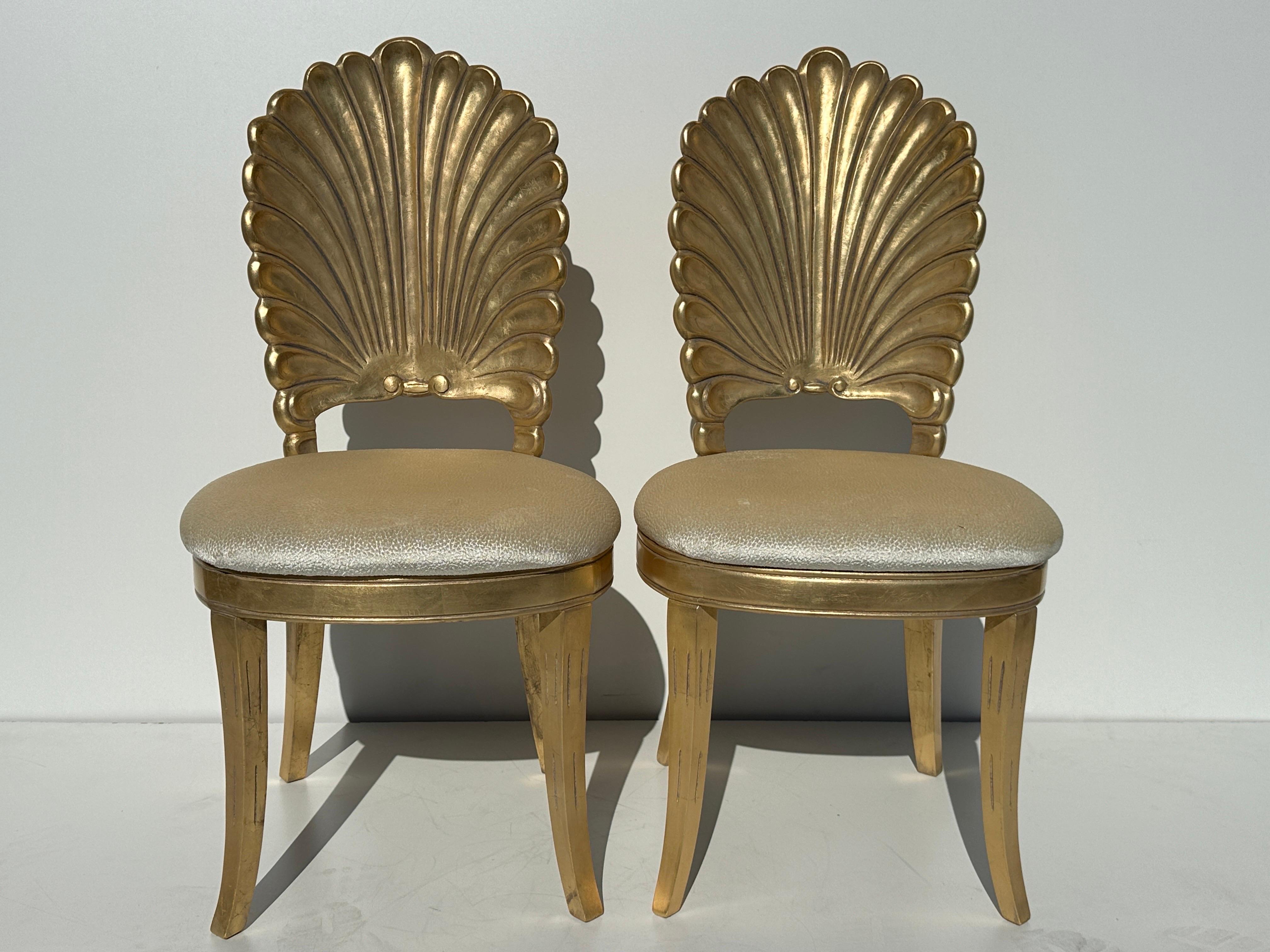 Pair of gold leaf grotto shell back side chairs.
These have been professionally restored, gold leafed and reupholstered. Please ask for upholstery fabric swatch if needed.
We also have set of six available in our other listing 1Stdibs reference