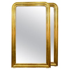 Coppia di specchi Louis Philippe a foglia d'oro con motivo a X