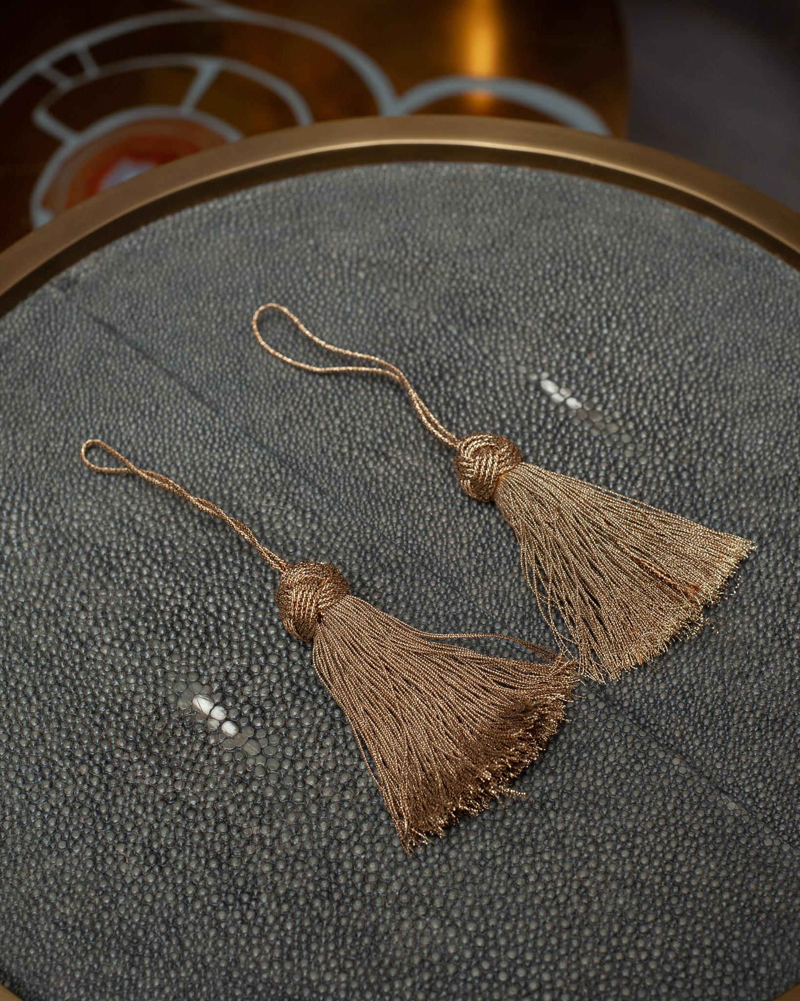 A beautiful pair of metallic silk tassels, from Bevilacqua Italy. Established by Luigi Bevilacqua, and operating out of Venice since 1875, Bevilacqua Tessuti produces the most exquisite handwoven fabrics available out of Europe following ancient
