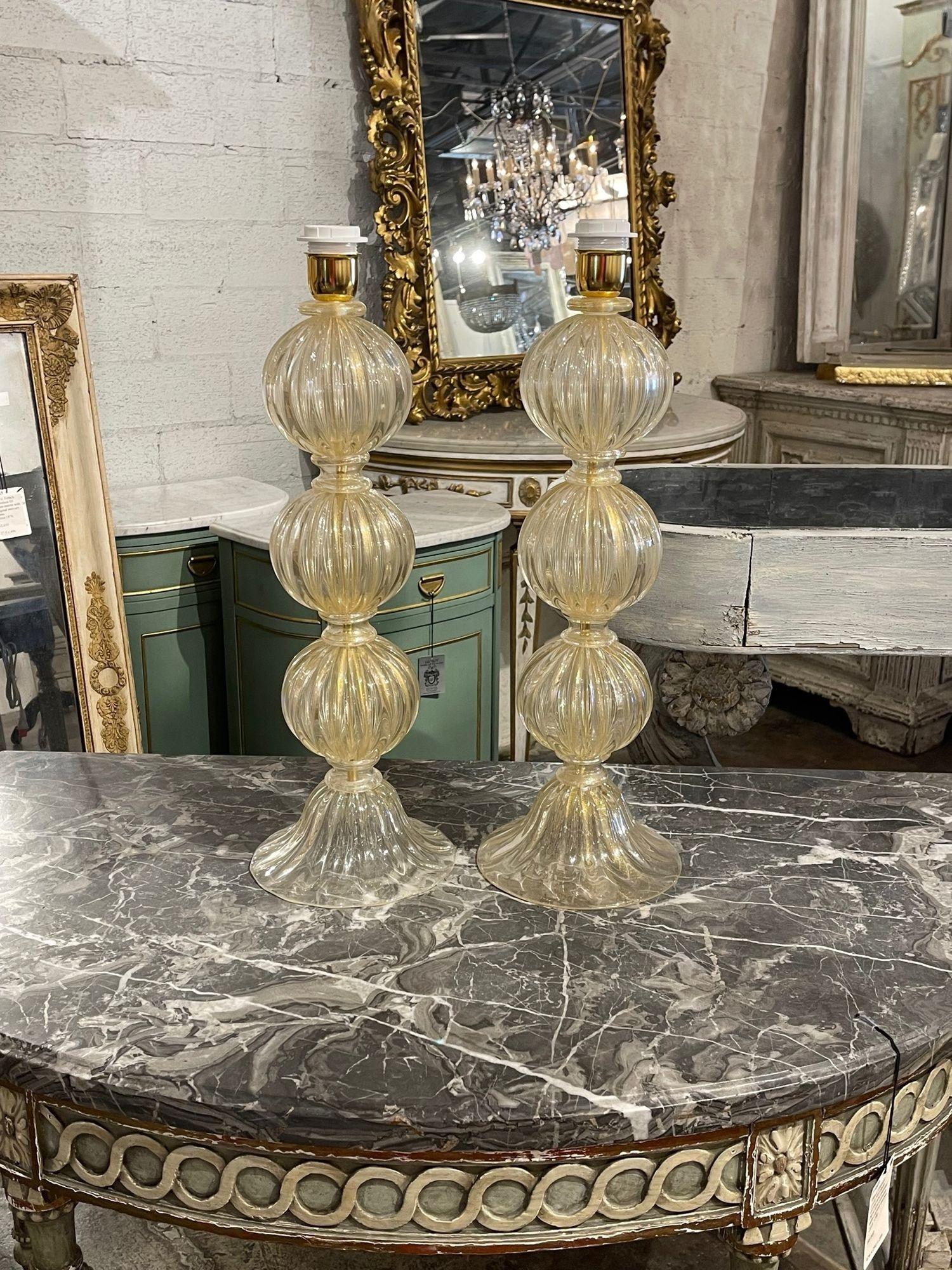 Stylish pair of gold Murano glass ball form lamps. Featuring beautiful glistening glass.  A lovely accessory!