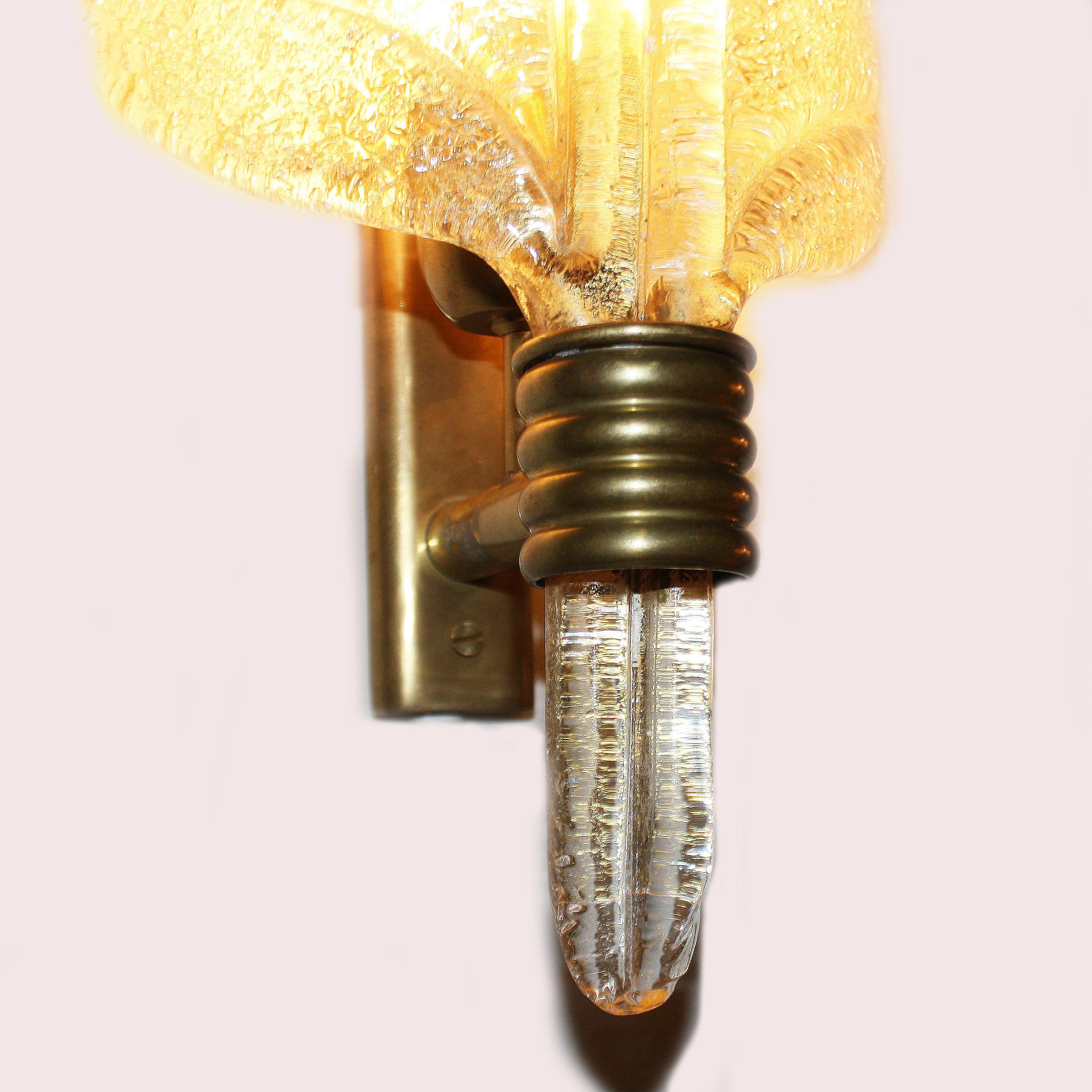 Pair of gold Murano glass feather sconces, circa 1940.
$4500.