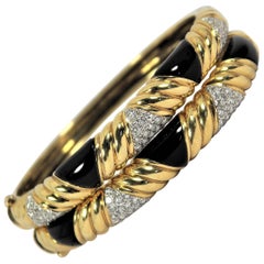 Pair of Gold, Onyx and Diamond Bangle Bracelets