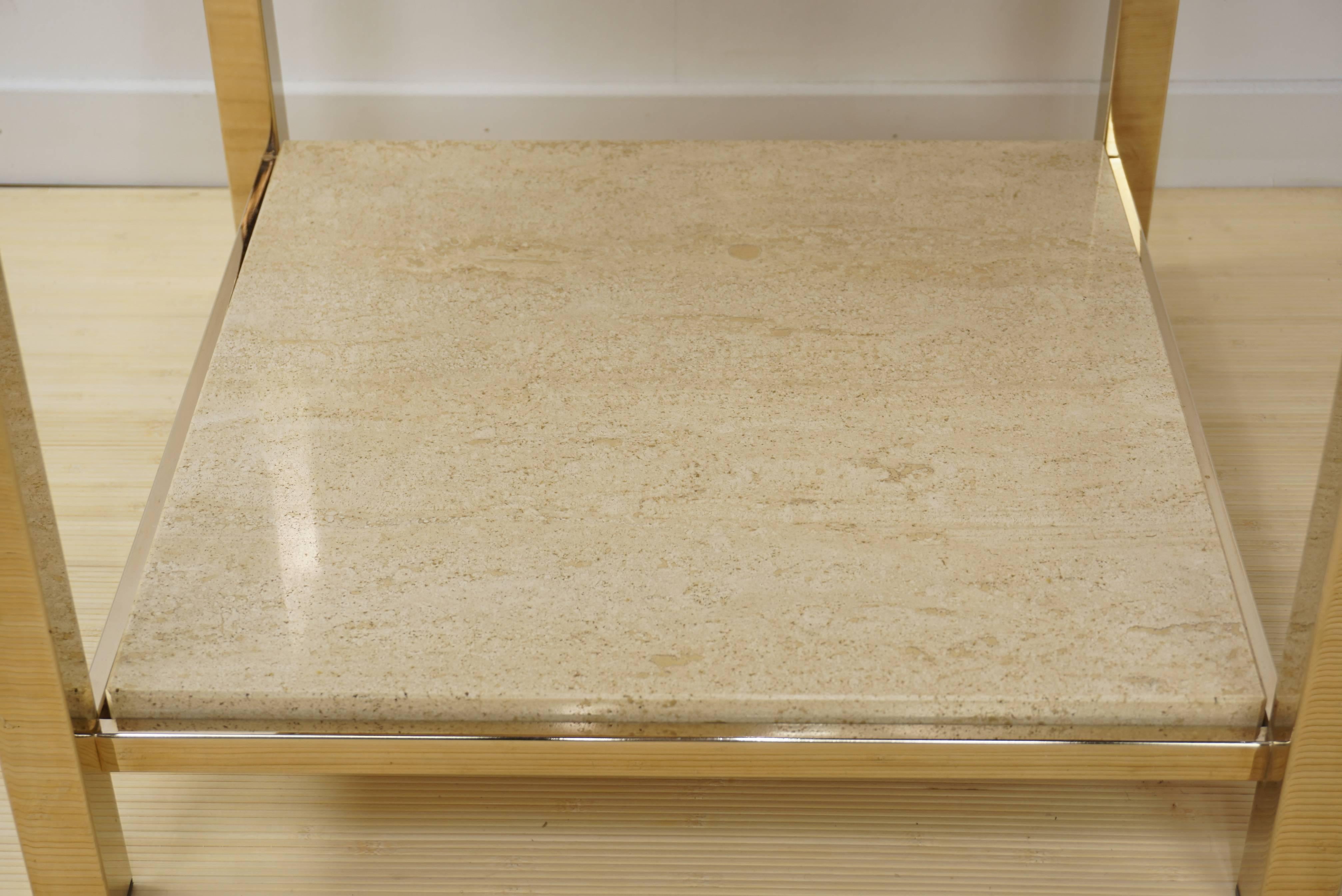 Pair of gold-plated side tables with shelf, 23-carat by Belgo Chrome, circa 1970s, Belgian. Belgo Chrome was known for its beautiful clean designs in hot metals and noble materials. These tables are emblematic of their 23-karat gold plated designs.