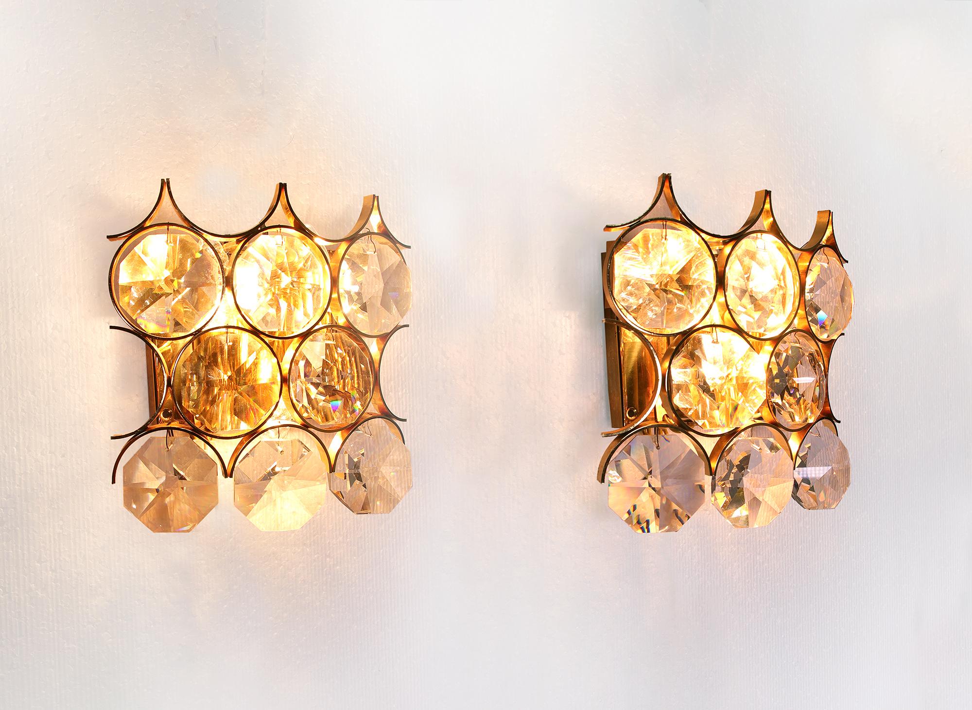 Elegant wall sconces with Swarovski crystals on a gold-plated frame. Manufactured by Palwa (Palme & Walter), Germany in the 1960s. 

Measures: width 8.6