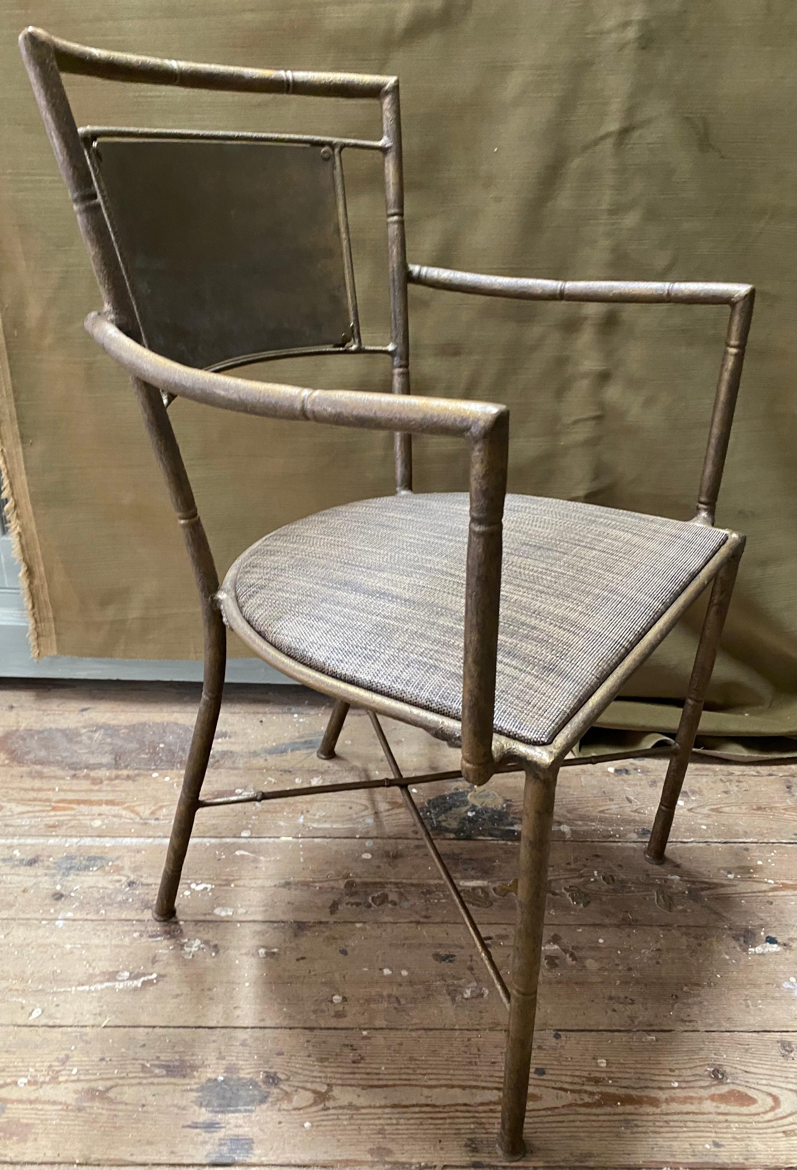 Pair of stylish indoor or outdoor gold tone iron metal garden arm chairs. Use the pair for dining chairs or for extra seating. Great for porch, patio or just about any room.
Measures: Arm heigh = 24.75