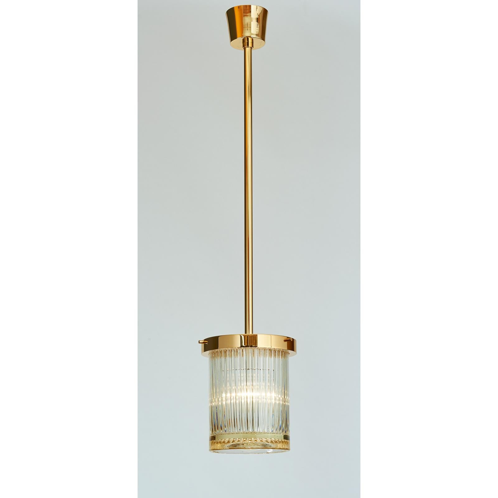 Mid-Century Modern Pair of Gold Toned Ribbed Glass Lanterns For Sale