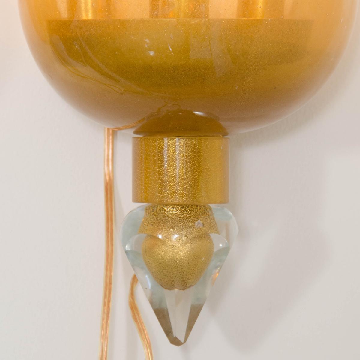 Mid-Century Modern Pair of golden amber glass sconces For Sale
