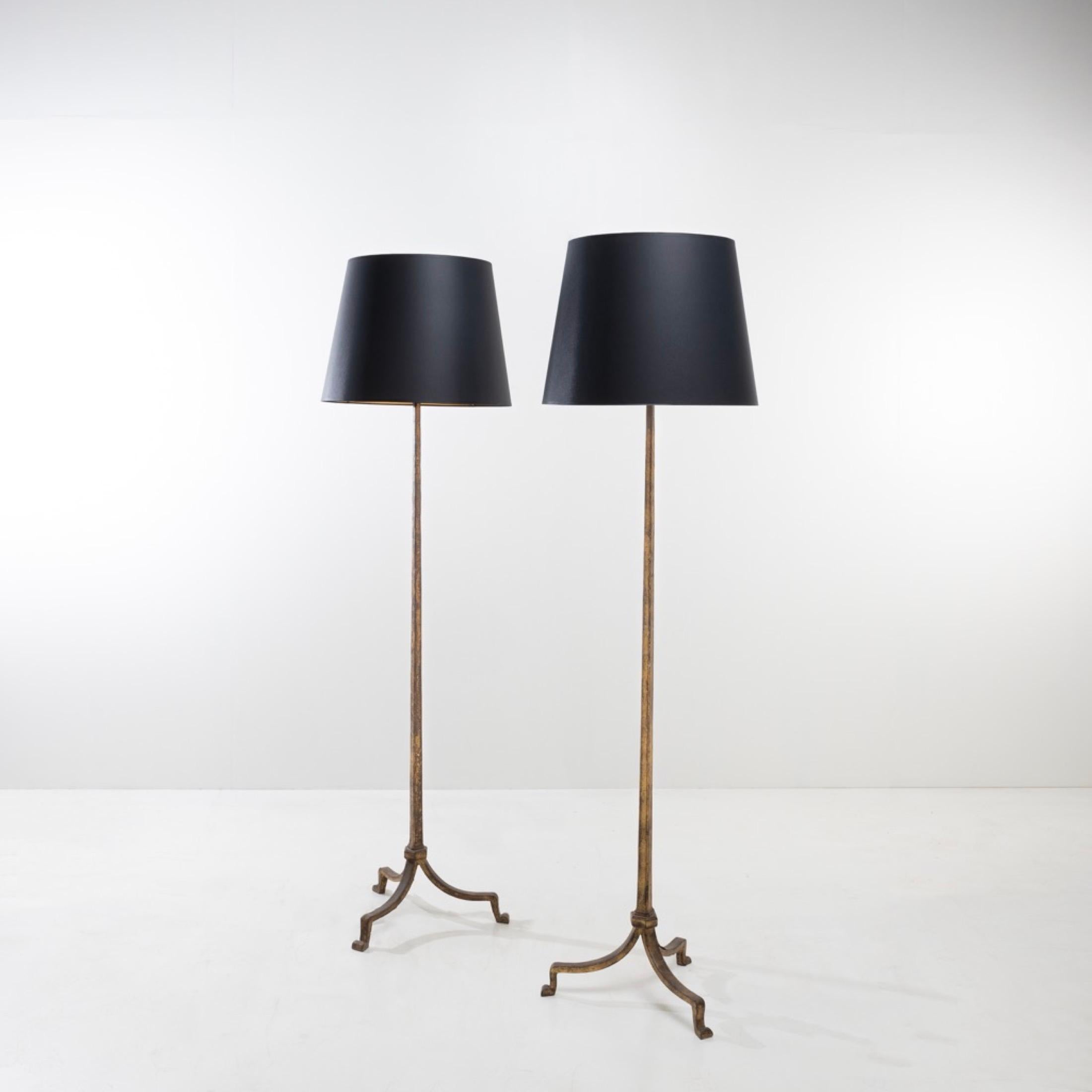 A pair of mid-century golden iron floor lamps designed and manufactured By Maison Ramsay, Paris France around 1950-1960. Very clean and sharp lines, the lamps are made of beaten iron. 
