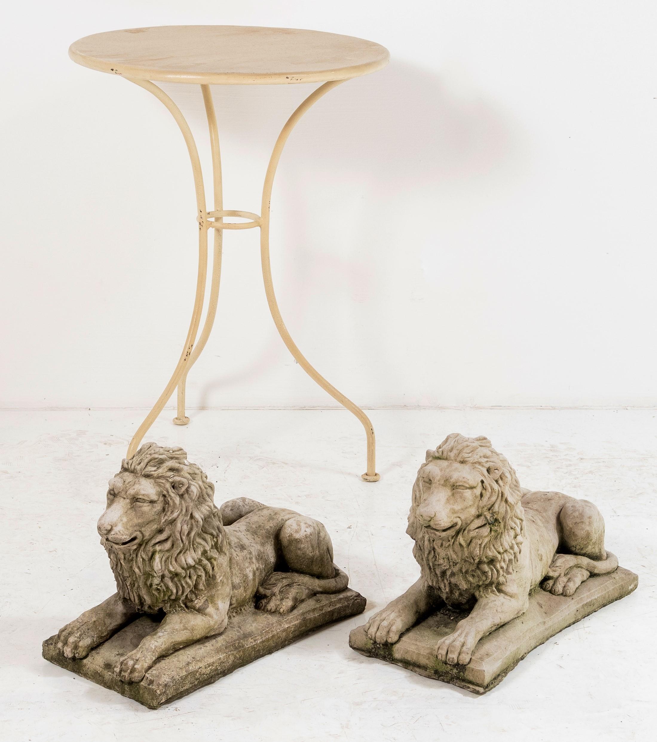 A pair of small composition stone recumbent lions, both front facing, very good detail and form, one slightly more weathered than the other but both make a good impression.
A good decorative addition to any garden, entrance or loggia, would also