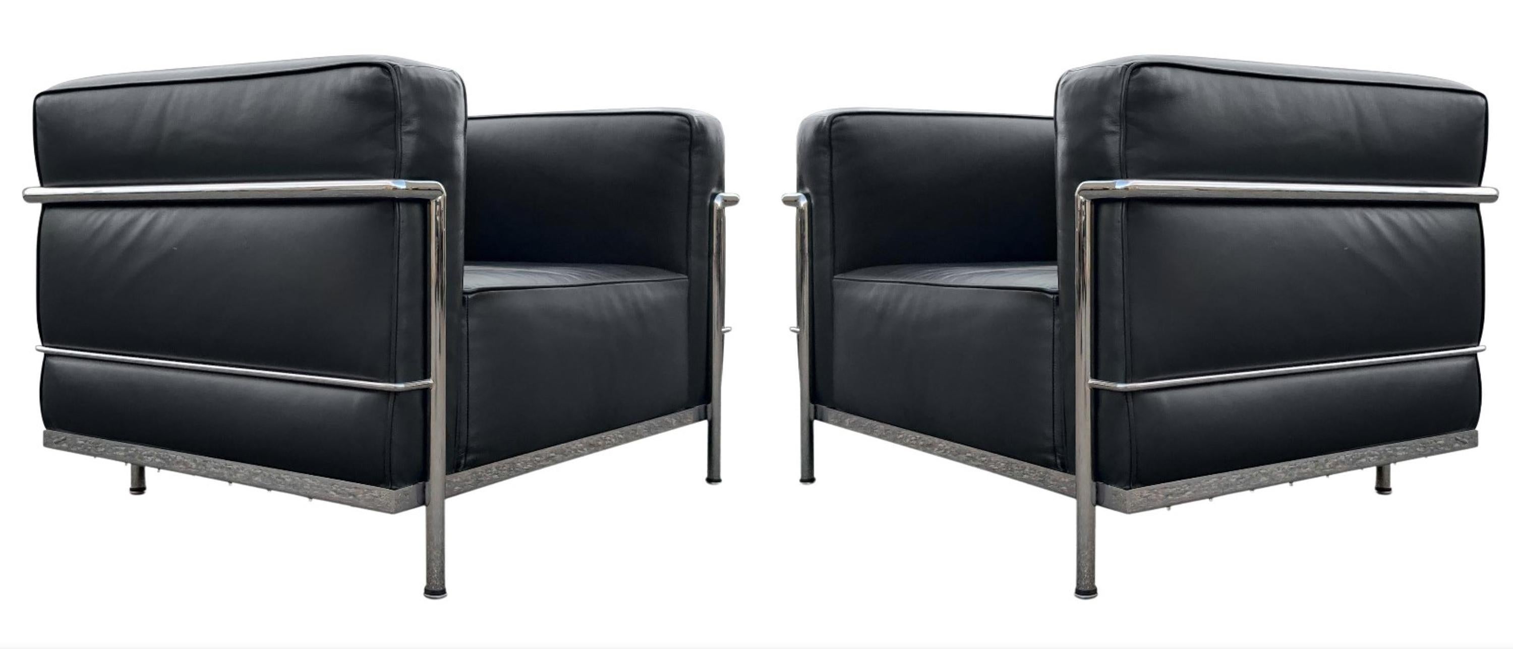 A pair of lounge or club chairs by Gordon International, in black leather upholstery and triple chrome-plated steel frames. Each chair is signed Gordon International beneath and in like new condition! Super clean and super comfortable! 

W 39