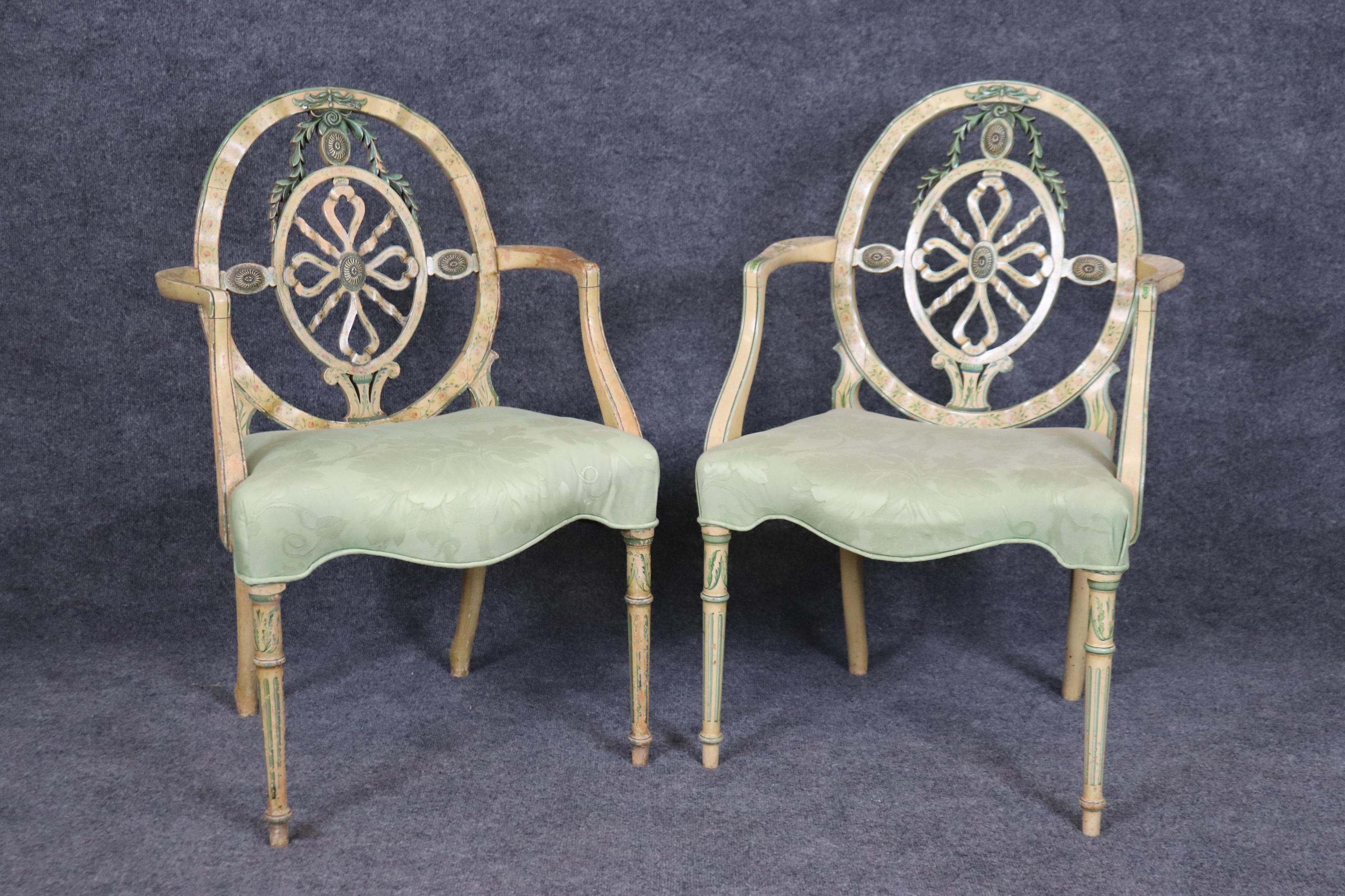 This is superb pair of English paint decorated Adams style chairs. The chairs are in good antique condition with fading and variations in the painted surfaces as we can see in the photos. The chairs upholstery is vintage so expect some stains or