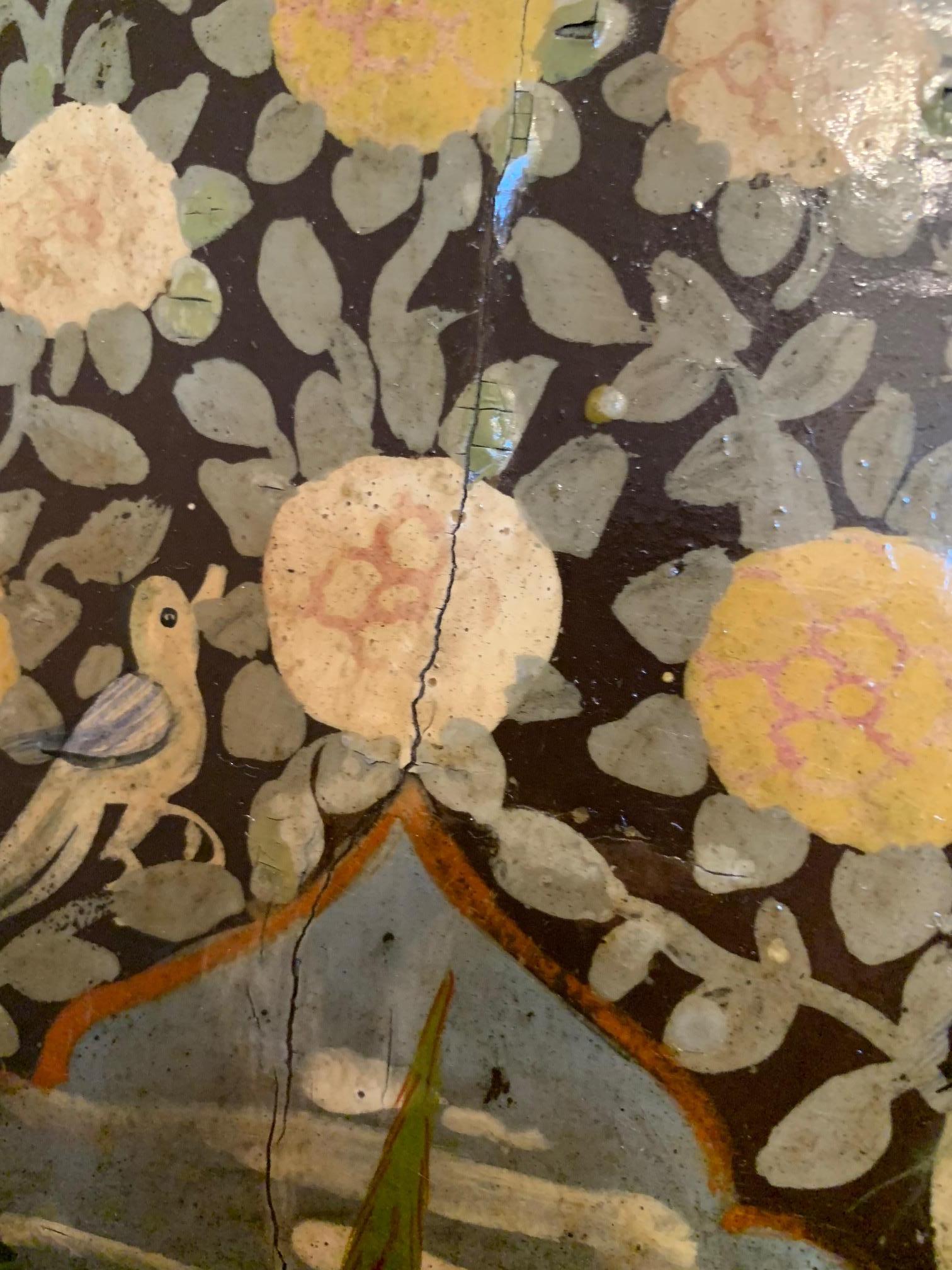 Incredibly detailed hand painted 19th century paneled cabinet doors having figures, birds and flowers in rich colors against chocolate brown background.
One panel is 19.25; the other 18.5
The two fit together and have worn original hardware.