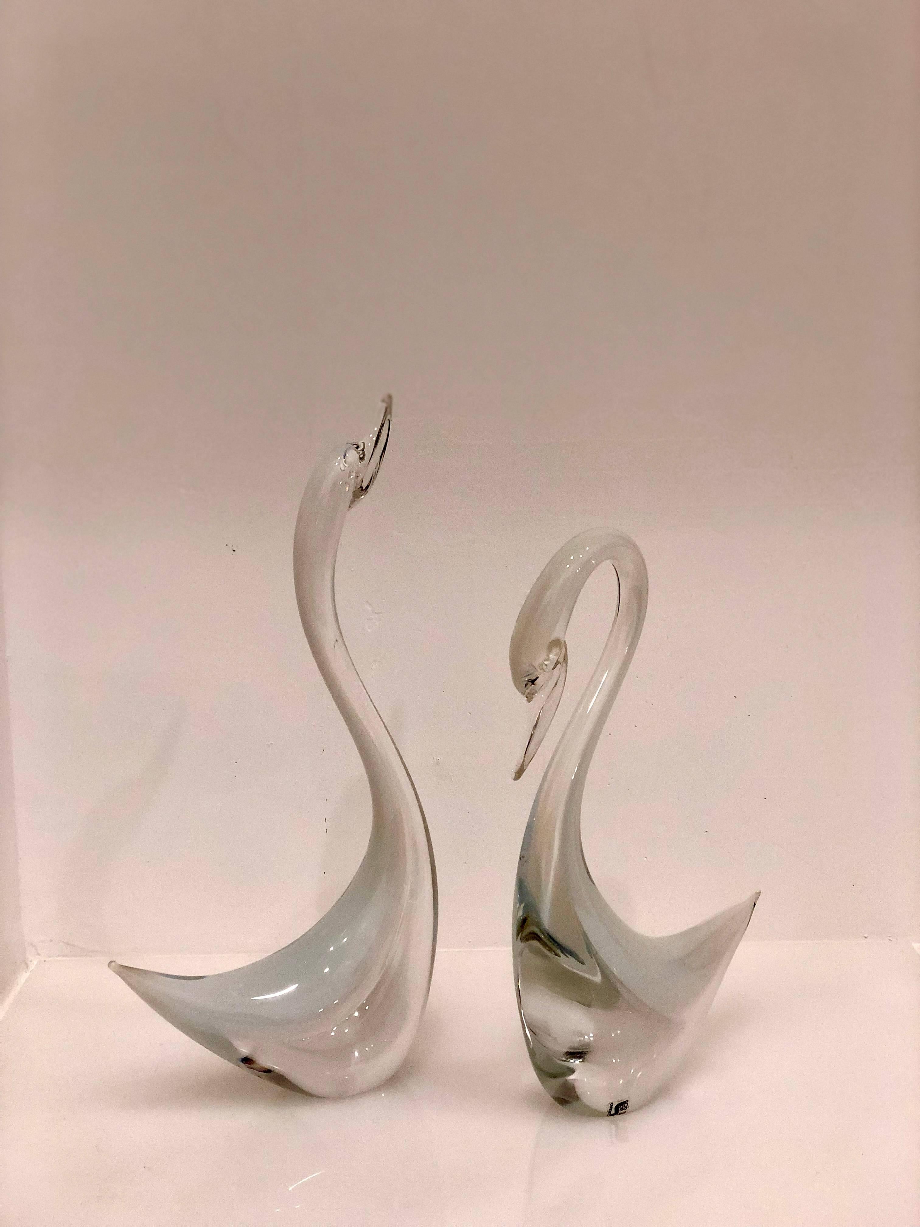 Beautiful and elegant tall glass sculptures by Seguso, circa 1960s retain label as shown clear and milk glass combination in excellent condition no chips or cracks, measure: the tallest its 19