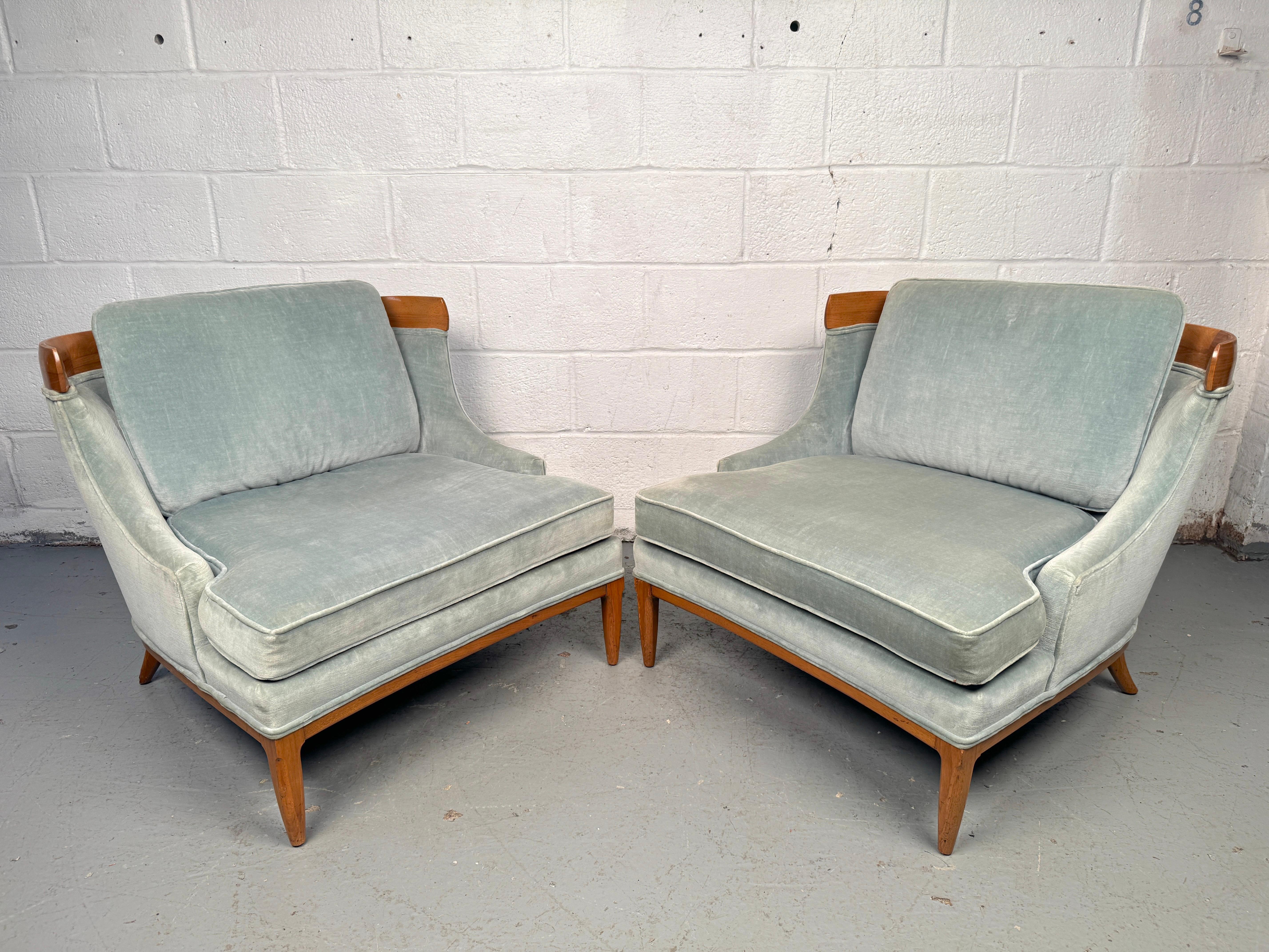Gorgeous pair of vintage lounge chairs designed by Erwin Lambeth and manufactured by Tomlinson. Featuring sculptural maple frames with upholstered fabric seats and backs, these chairs combine refined craftsmanship with modern elegance. A rare and