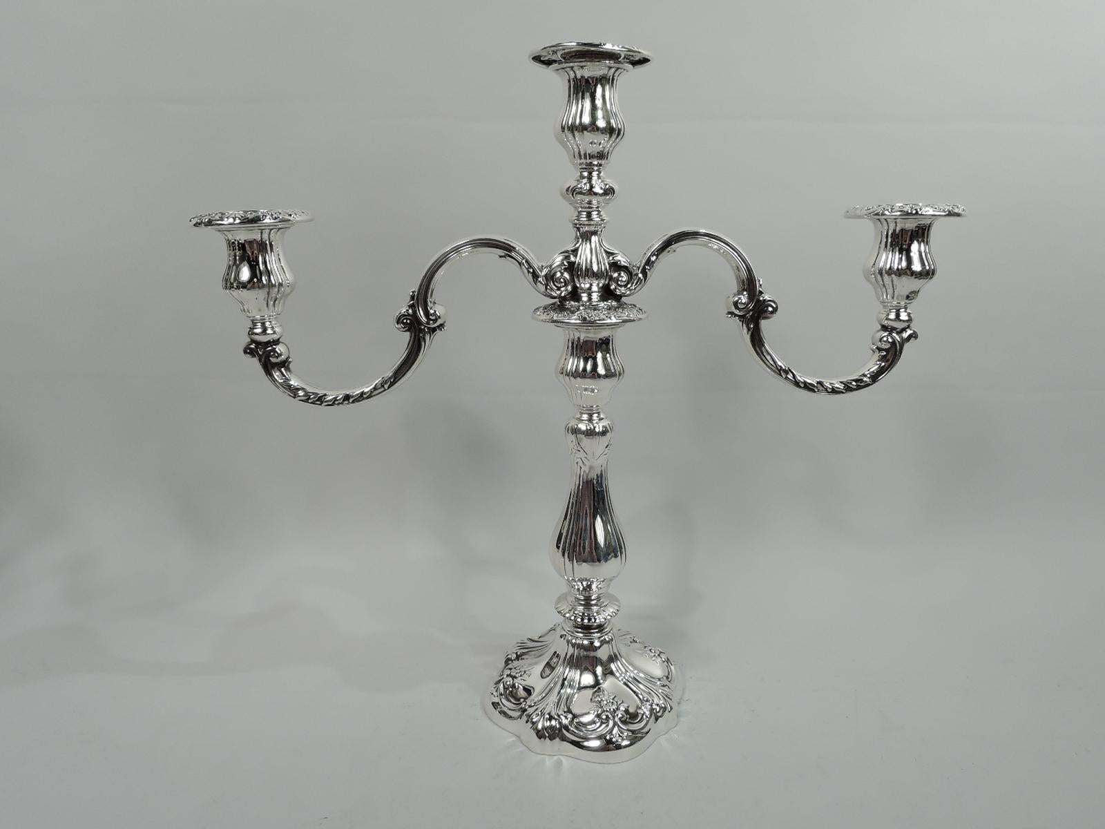 Pair of Edwardian Art Nouveau sterling silver 3-light candelabra. Made by Gorham in Providence in 1904-5. Each: Knopped baluster shaft on raised shaped foot. Central socket between leaf-mounted and -wrapped s-scroll arms, each terminating in single