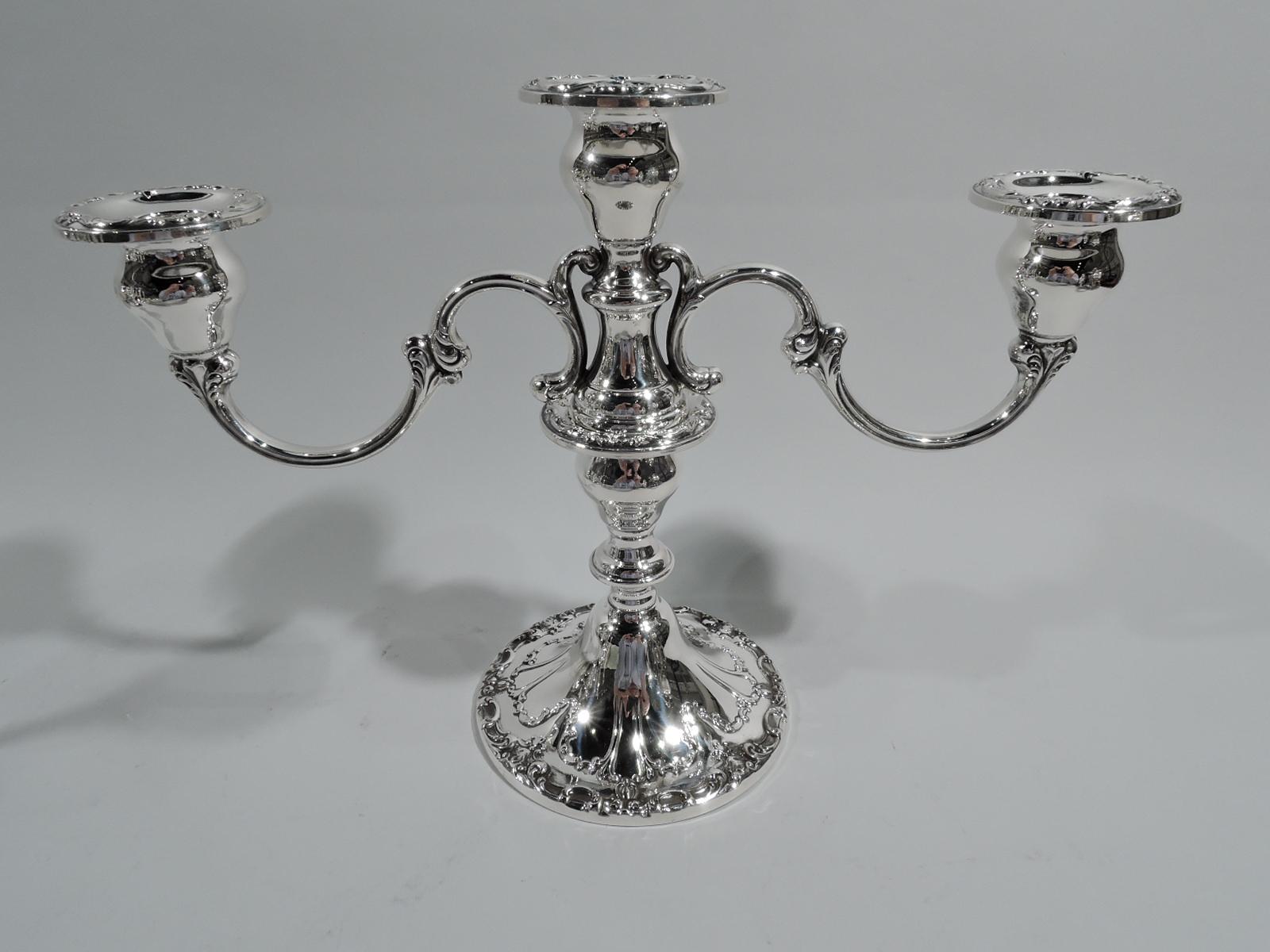 Pair of Chantilly Duchess sterling silver 3-light candelabra. Made by Gorham in Providence. Each: Central socket mounted with 2-scroll arms, each terminating in single socket. Knopped and baluster shaft on raised foot. Low-relief scroll and flower