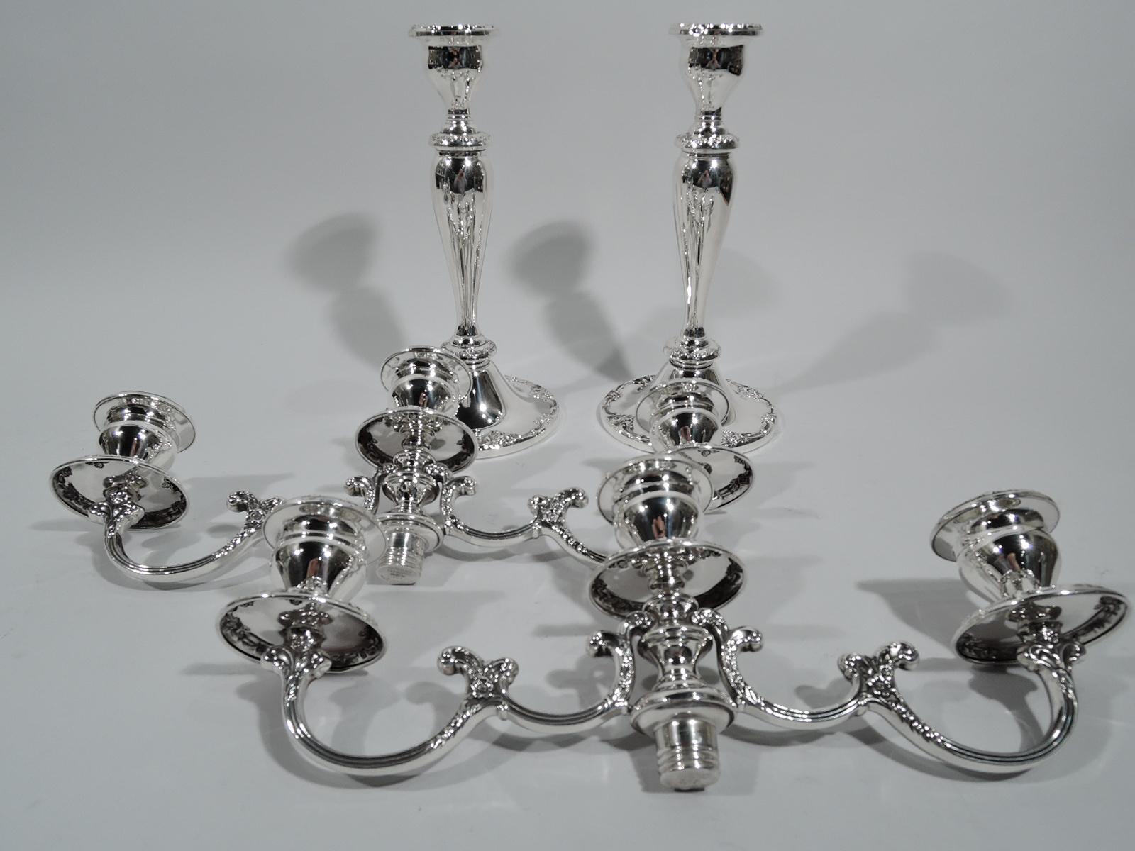 Pair of Melrose sterling silver 3-light candelabra. Made by Gorham in Providence. Each: Flanged baluster shaft on domed foot. Two scrolled arms, each terminating in single socket mounted to spool support surmounted in same. Raised scroll and floral