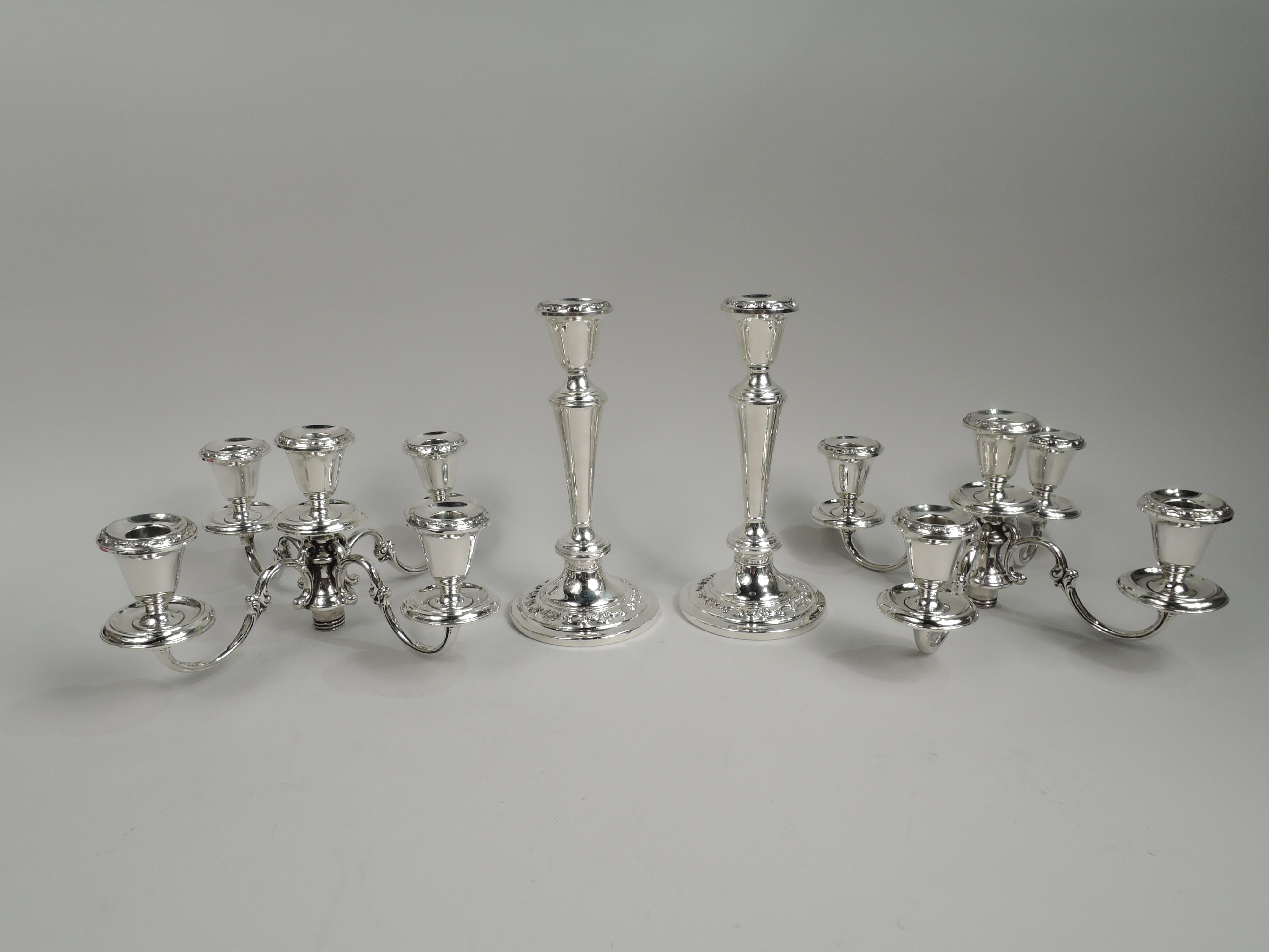 Pair of Strasbourg sterling silver 5-light candelabra. Made by Gorham in Providence. Each: Knopped and tapering shaft on raised foot; four s-scroll arms, each terminating in single socket mounted to wax pan surrounding central raised socket. Raised