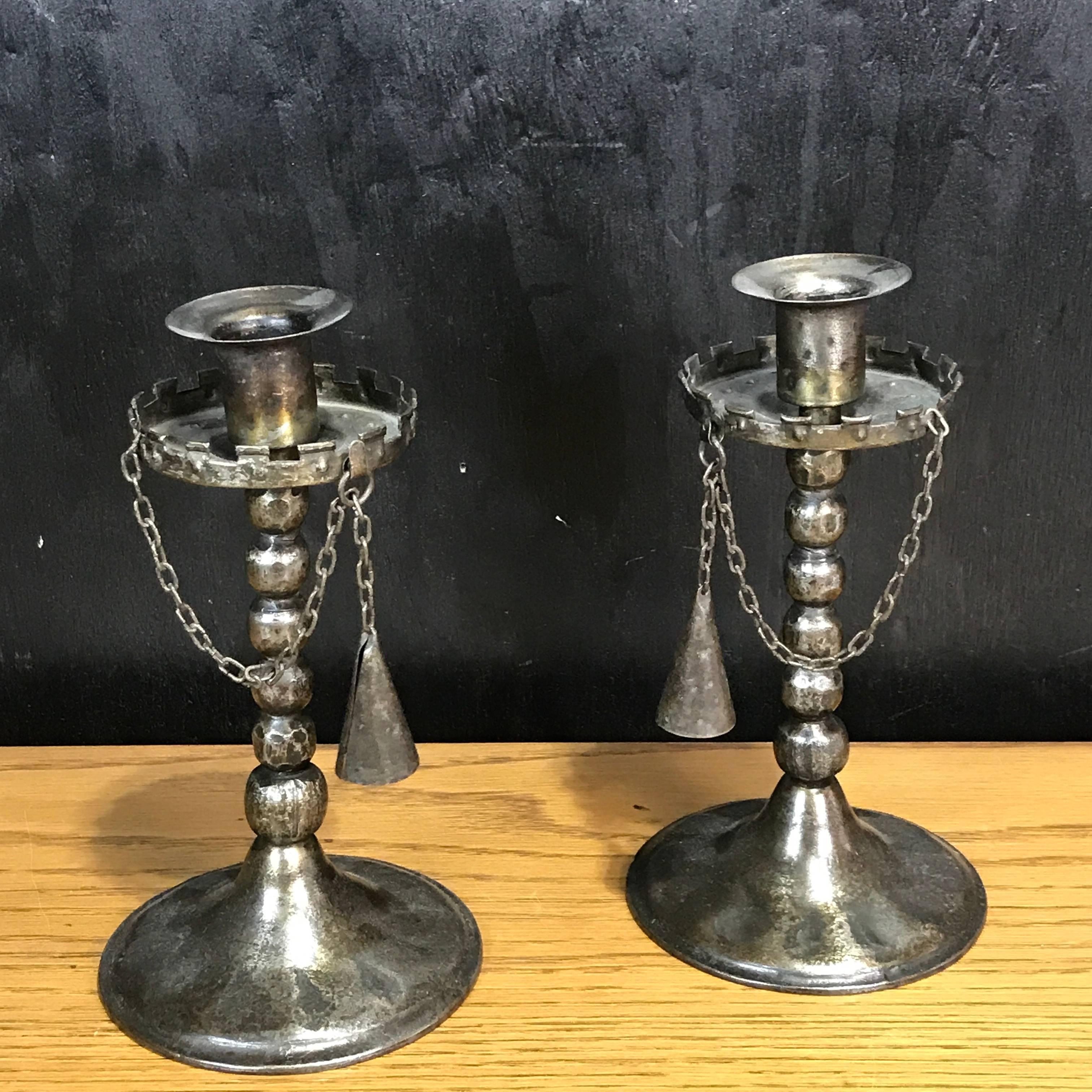 Pair of Gothic iron candlesticks with snuffers, each one with chained candlesnuffer, stamped Germany, known Goberg Metalworks form.