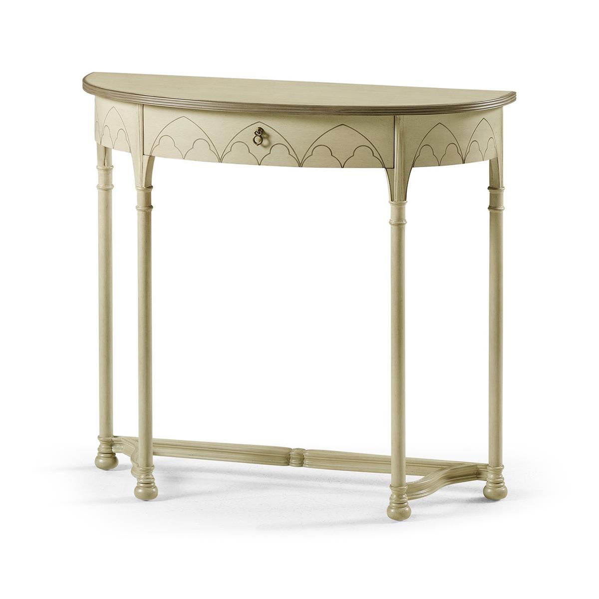 Gothic painted console tables with an antique clary sage finish, in an 18th-century gothic style, the demilune half-round form with fine contrasting inlays to the top and frieze, and legs with painted running floral motifs and arches.

Dimensions: