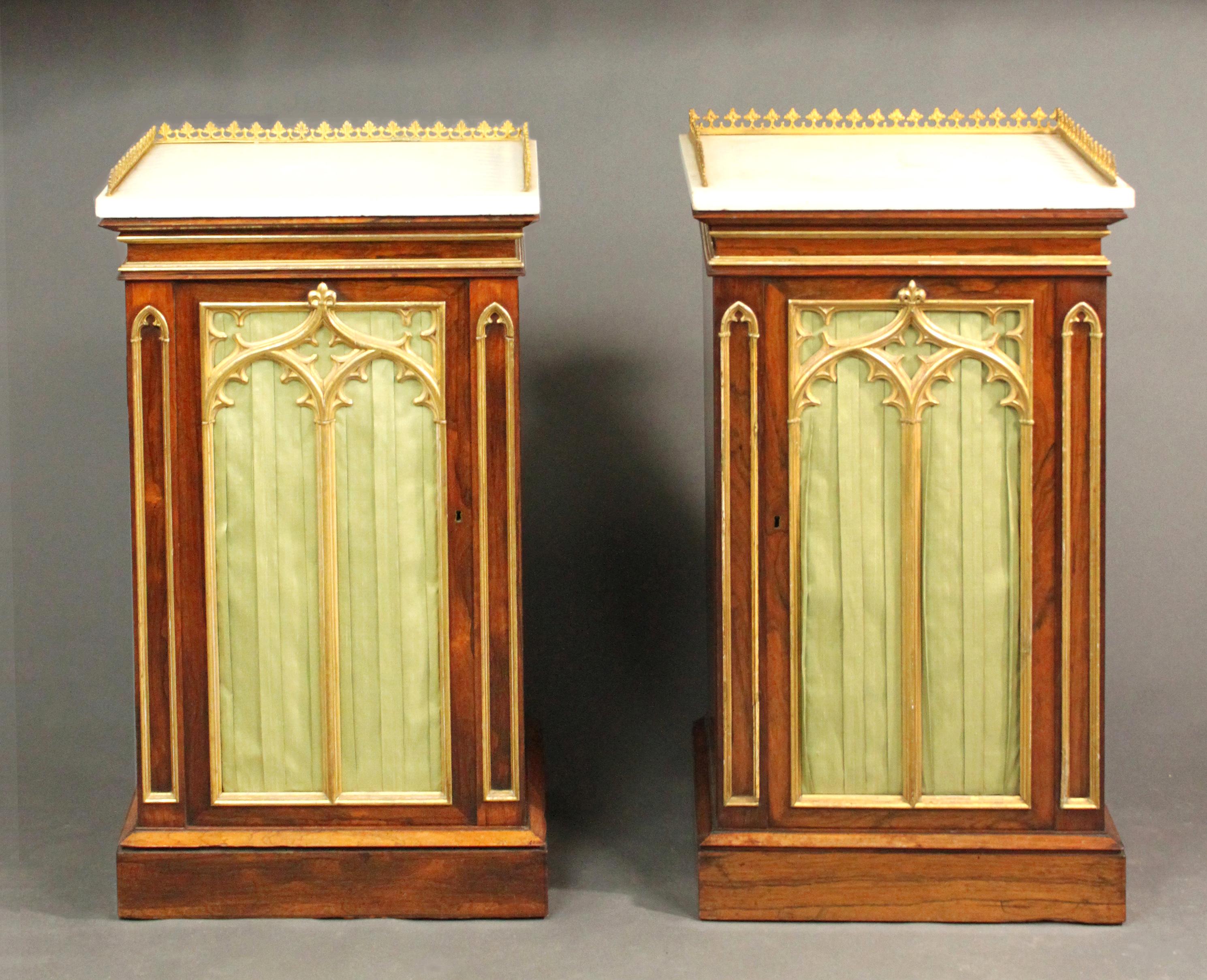 A fine pair of Regency rosewood pedestal cupboards with attractive gilt 