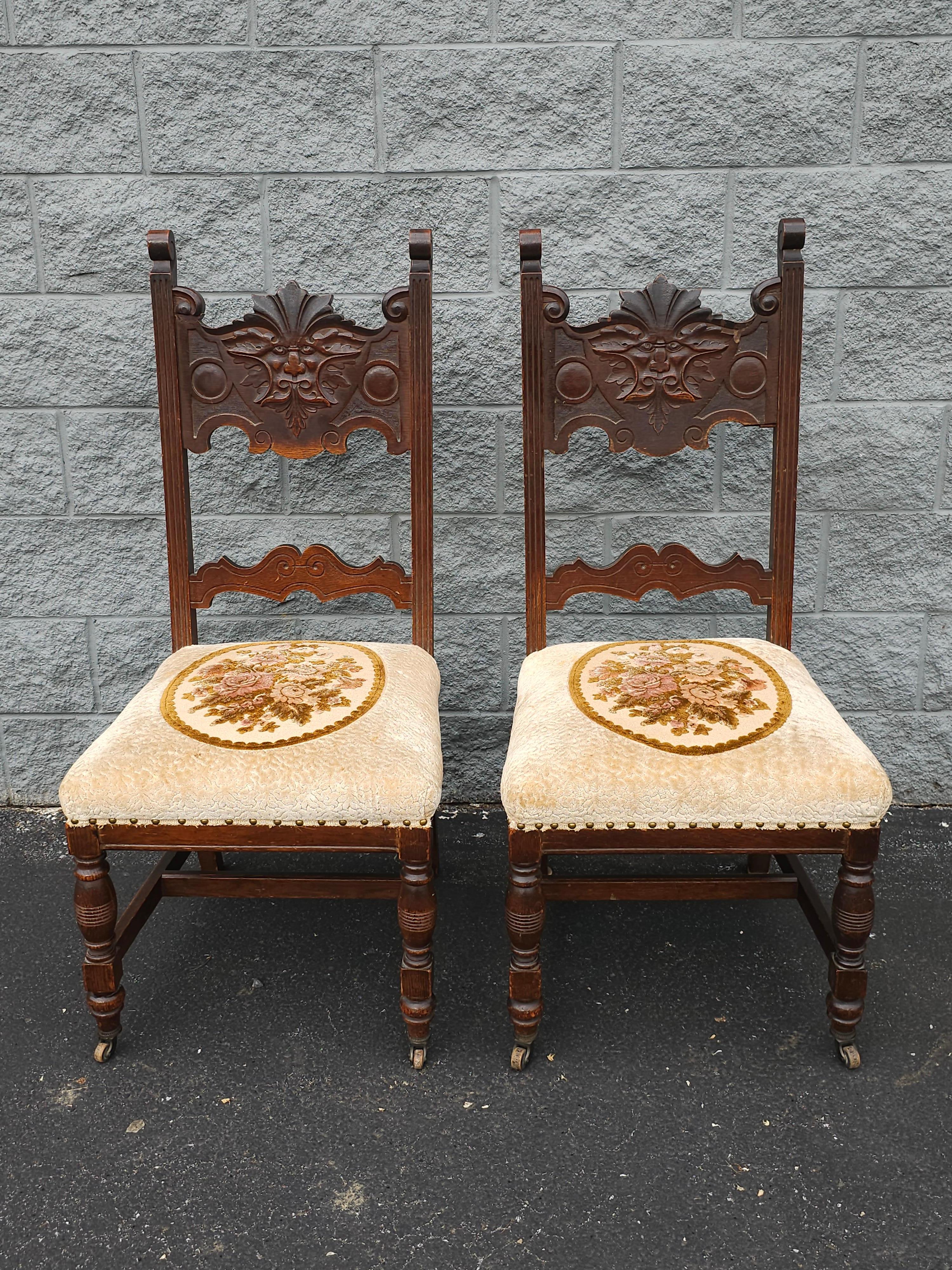 A Pair Of Gothic Revival Style Stained Oak Wood And Upholstered Seat high back Side Chairs. 